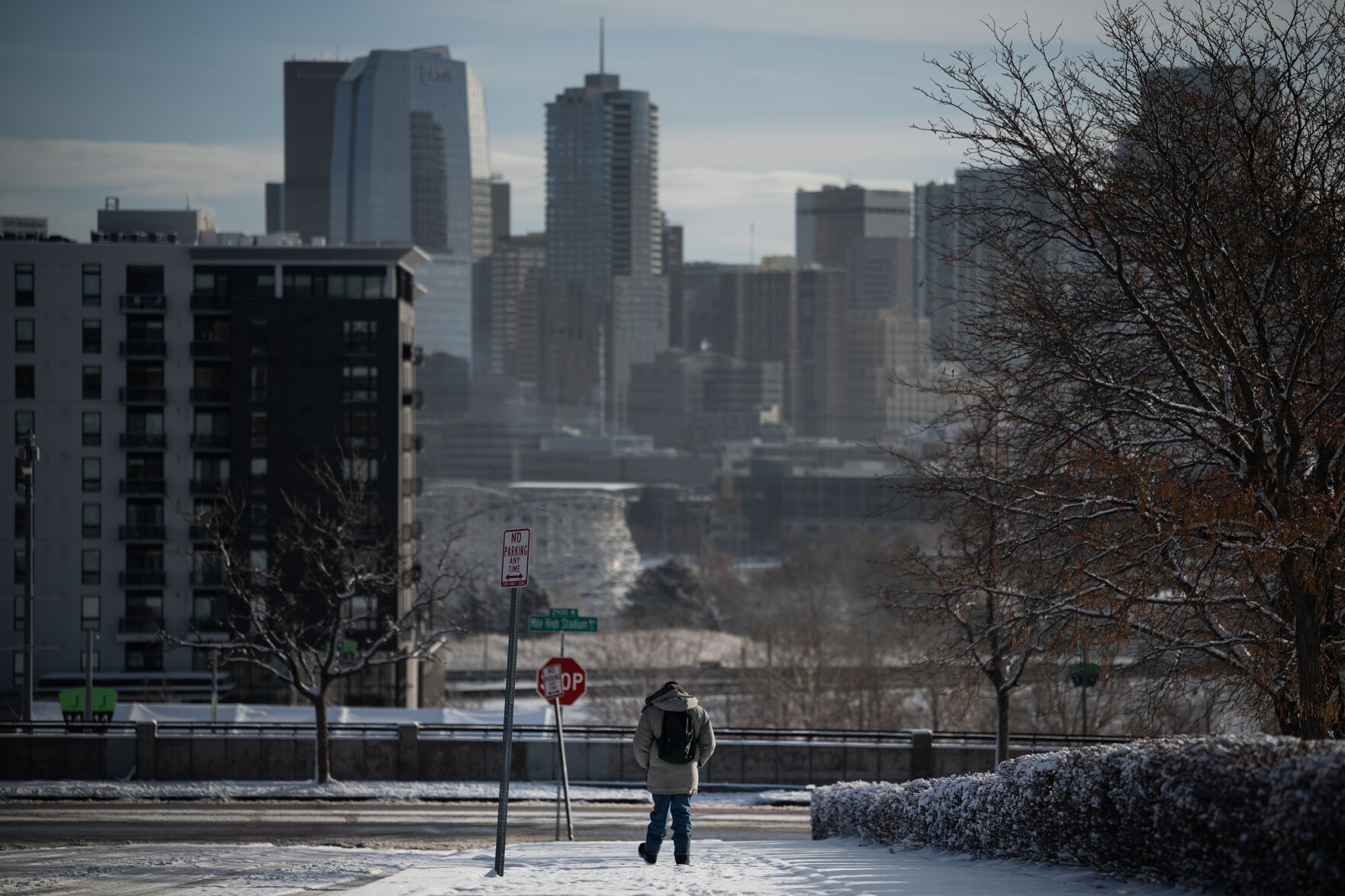 An immigrant worker walks up and down West 19th Avenue while waiting outside for potential work on Dec. 9 in Denver. (TimHursttim.hurst@gazette.comhttps://secure.gravatar.com/avatar/aca82bd62b4ee425c598527cd6faa1b1?d=mm&r=g)