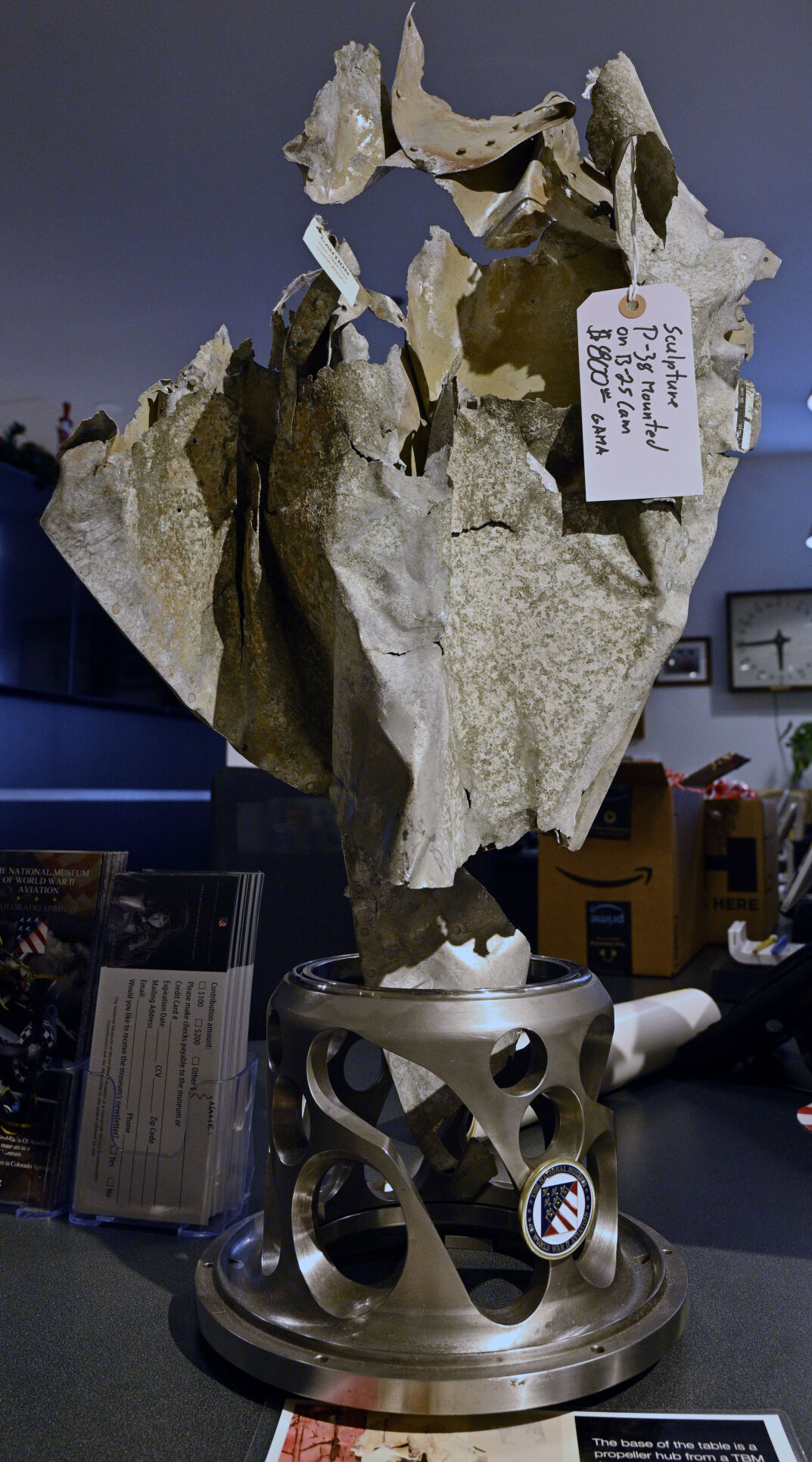 This sculpture runs $800 and is made from the aluminum skin of a P-38 mounted on a cam from a B-25. (jerilee bennett, the gazette)