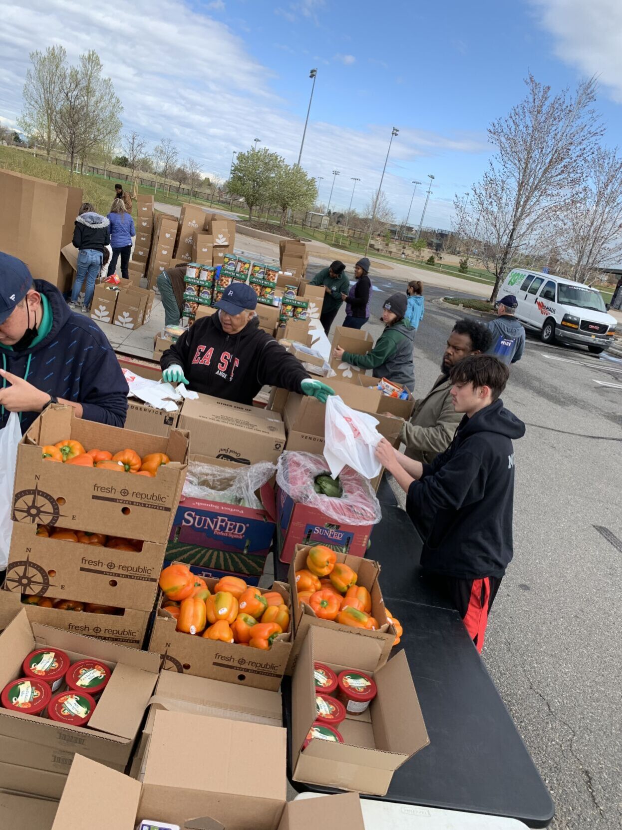 FILE PHOTO: Volunteers and Food Bank of the Rockies employees pack boxes with food to be distributed to those who need it at the mobile food pantry at Montbello Recreation Center in Aurora. The nonprofit organization is one of many participating in Colorado Gives Day Tuesday. (Dennis Huspeni/Denver Gazette)