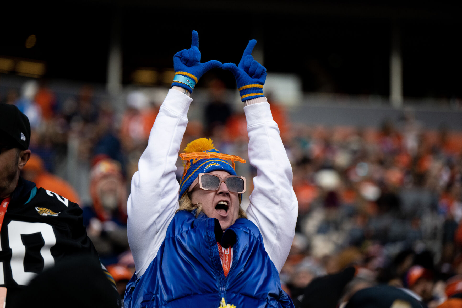 A Los Angeles Chargers fan cheers after they scored a field goal in the first half of a game on Sunday, Nov. 26, 2023, at Empower Field at Mile High in Denver, Colo. (Parker Seibold, The Gazette) (Parker Seibold)