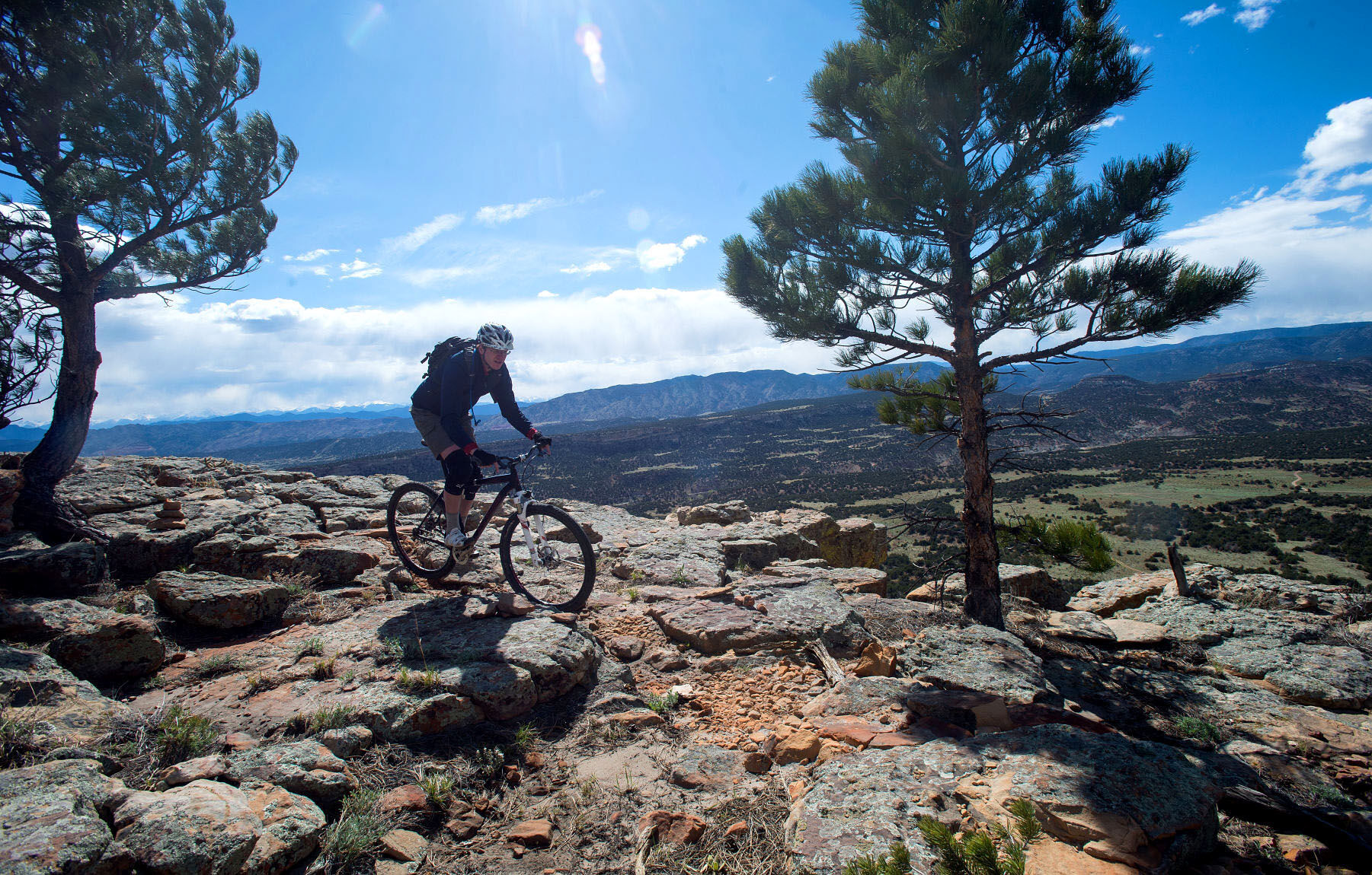Lance Benzel of Colorado Springs rides a trail Tuesday, April 29, 2014, on the 200-foot cliffs in the Oil Well Flats area north of Canon City. (The Gazette, Christian Murdock)