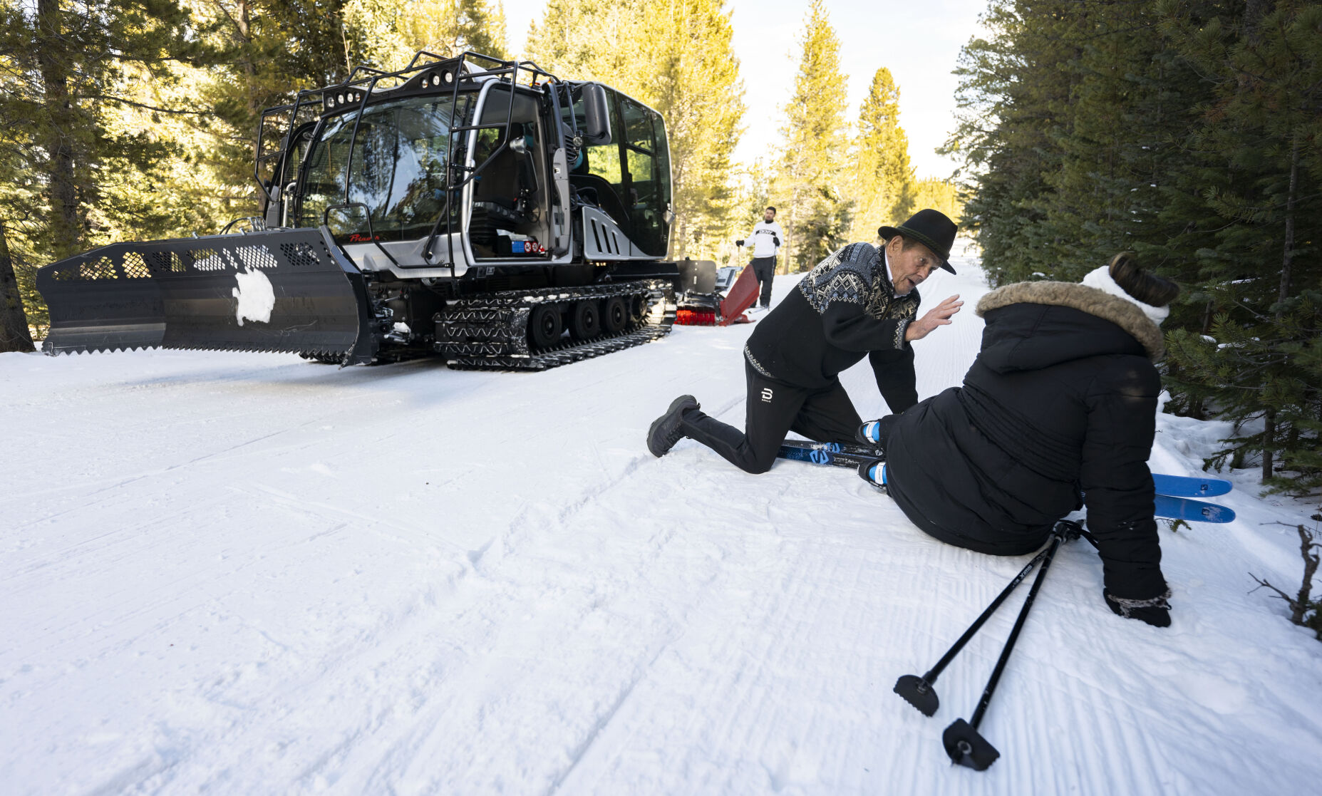 Breckenridge Nordic Center founder and owner Gene Dayton, 80, stops to help a fallen skier while grooming the trails in one of the center’s snowcats Thursday, Nov. 30, 2023, at the center in Breckenridge. (Christian Murdock, The Gazette)