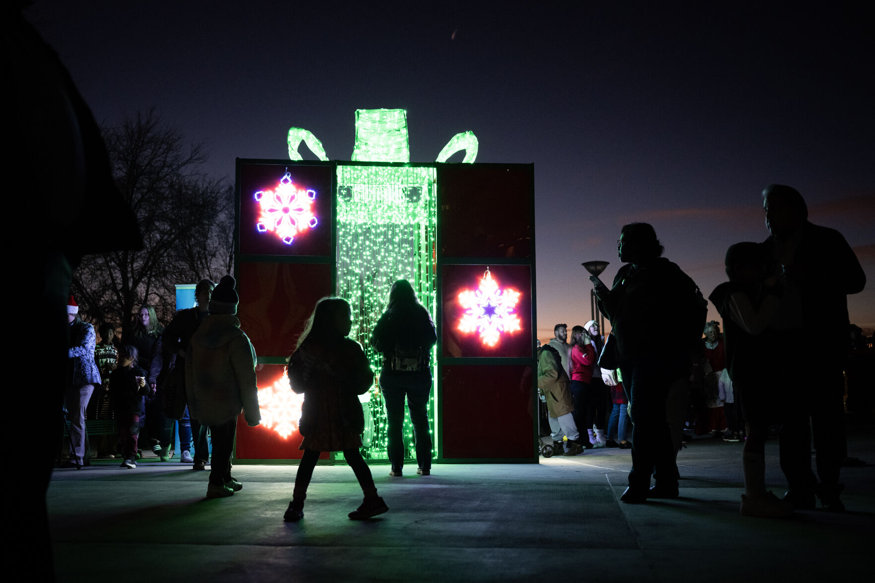 A giant present lights up the night during the city of Aurora’s annual Holiday Tree Lighting on Tuesday, Dec. 5, 2023, at the Aurora Municipal Center. (Timothy Hurst/Denver Gazette) (TimHursttim.hurst@gazette.comhttps://secure.gravatar.com/avatar/aca82bd62b4ee425c598527cd6faa1b1?d=mm&r=g)