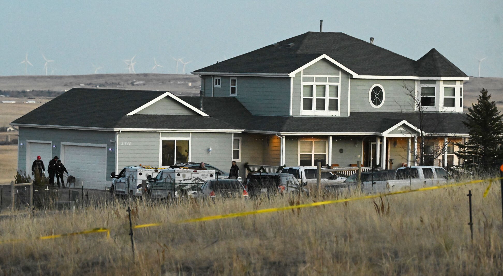 At about dusk on Thursday, Dec. 7, 2023, investigators from the El Paso County Sheriff’s Dept. and officers from the Humane Society of the Pikes Peak Region were still on the scene at a house north of Peyton where four adults were found dead late Wednesday night. The home is about 8 miles northeast of Peyton at 21885 Akawi Way.