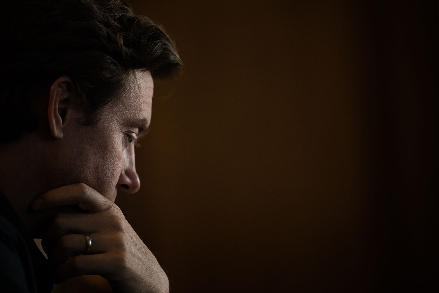 Denver mayor Mike Johnston looks down while thinking about a question during an interview in his office at the Denver City & County Building on Monday, Dec. 11, 2023. (Timothy Hurst/Denver Gazette) (TimHursttim.hurst@gazette.comhttps://secure.gravatar.com/avatar/aca82bd62b4ee425c598527cd6faa1b1?d=mm&r=g)