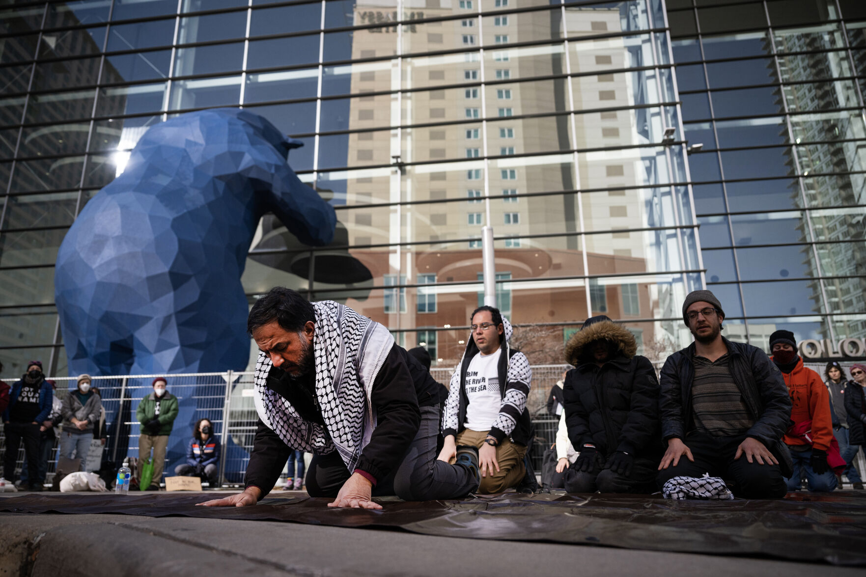 Anwar Zuraigat, left, leads Friday prayer during a break in an all-day picketing outside the Colorado Convention Center in protest of the Jewish National Fund-USA’s Global Conference for Israel on Friday, Dec. 1, 2023, in Denver, Colo. (Timothy Hurst/Denver Gazette) (TimHursttim.hurst@gazette.comhttps://secure.gravatar.com/avatar/aca82bd62b4ee425c598527cd6faa1b1?d=mm&r=g)