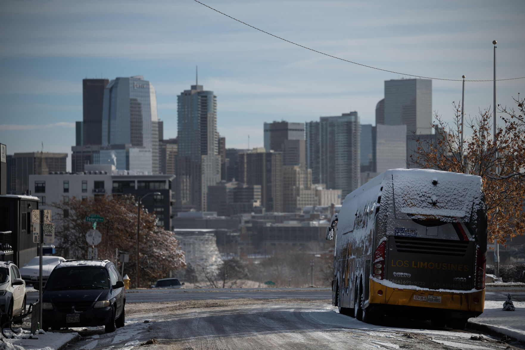 A bus that dropped off newly-arrived immigrants after an overnight drive from El Paso, Texas, sits parked at Federal Boulevard and West 19th Avenue on Saturday, Dec. 9, 2023, in Denver, Colo. (Timothy Hurst/Denver Gazette) (TimHursttim.hurst@gazette.comhttps://secure.gravatar.com/avatar/aca82bd62b4ee425c598527cd6faa1b1?d=mm&r=g)