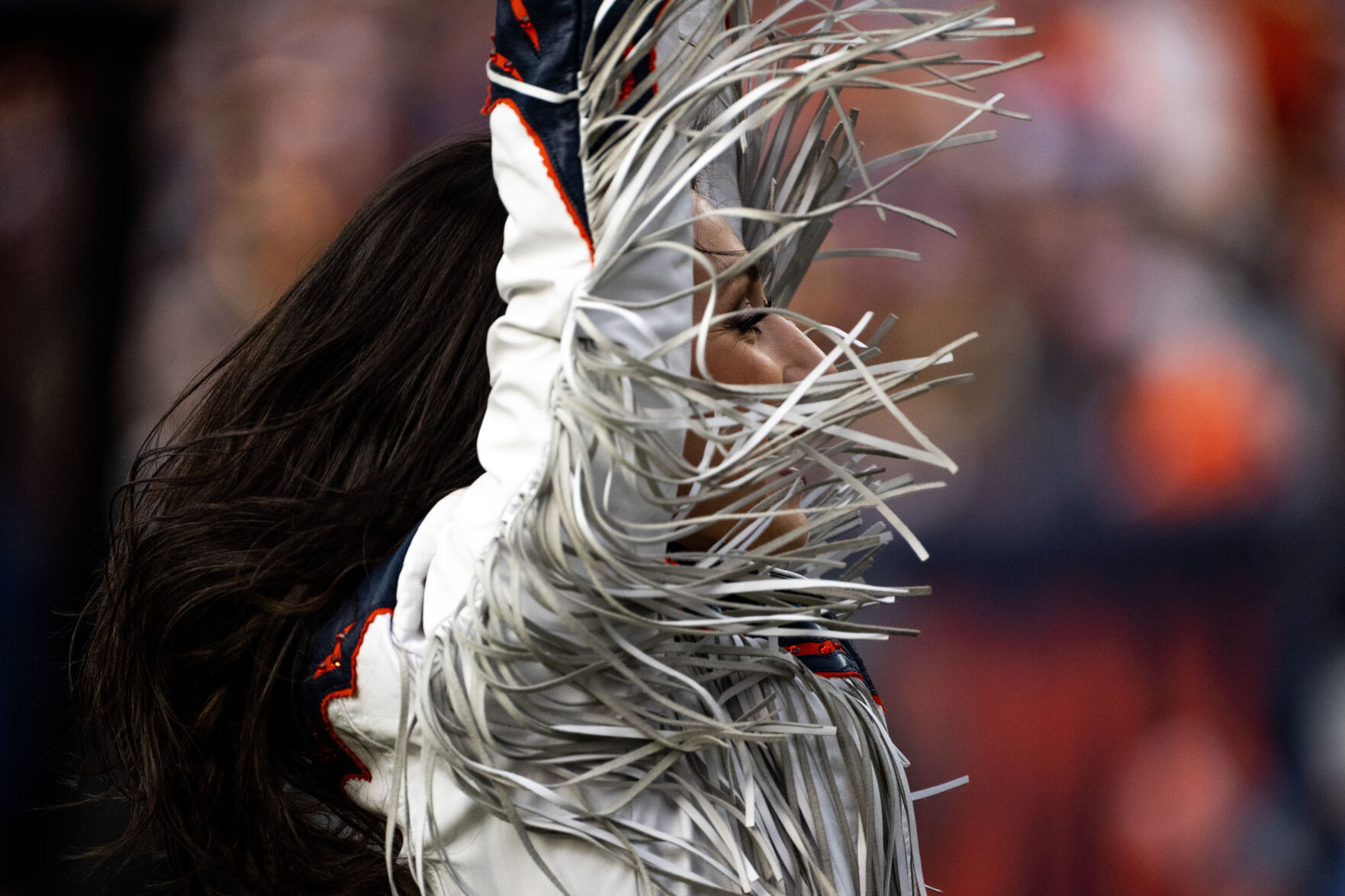 A Denver Broncos cheerleader dances in the first half of a game on Sunday, Nov. 26, 2023, at Empower Field at Mile High in Denver, Colo. (Parker Seibold, The Gazette) (Parker Seibold)