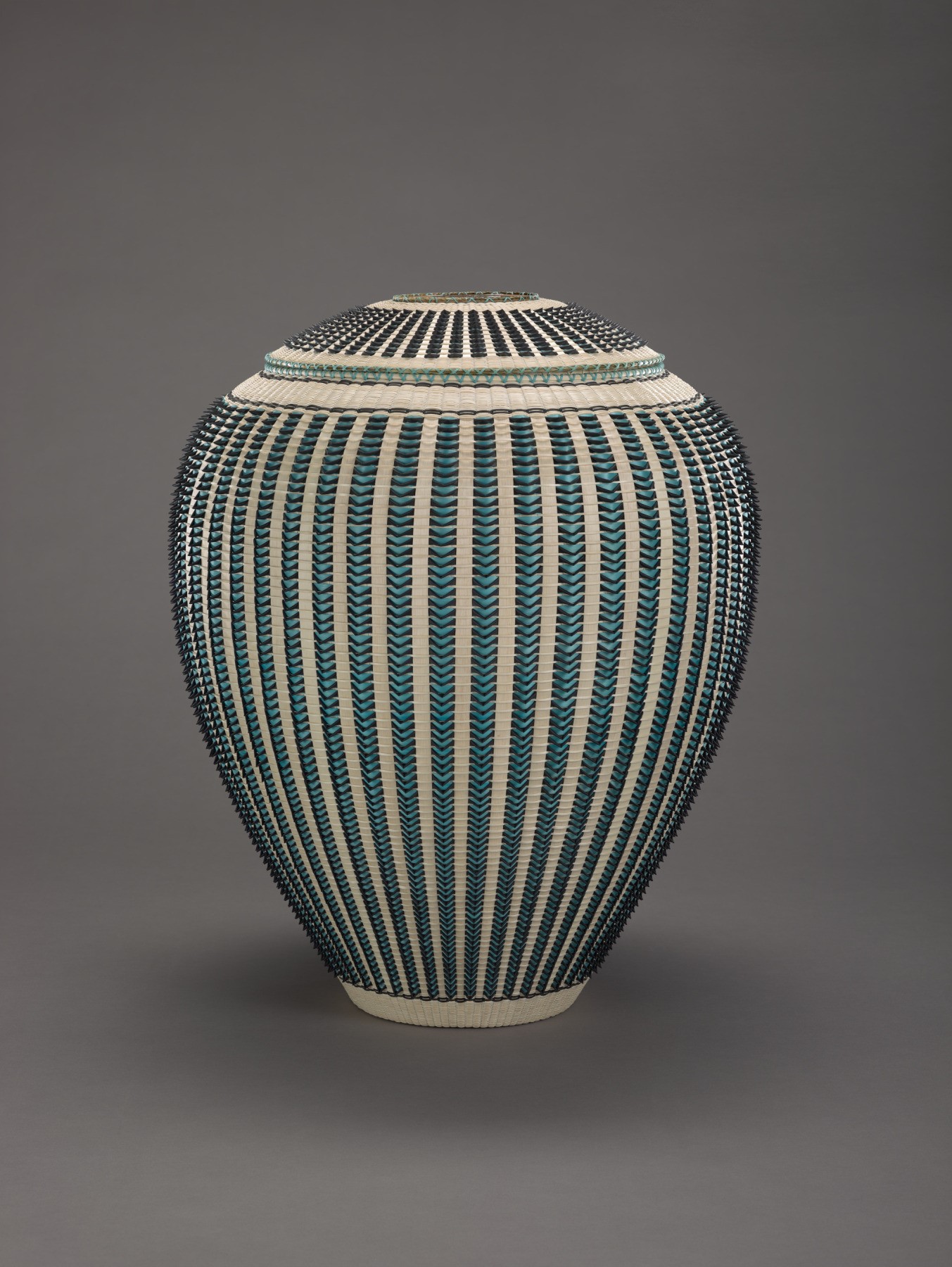 Jeremy Frey (Passamaquoddy), Watchful Spirit, 2022. Ash tree fibers, porcupine quill, and sweet grass; 27 3/8 in. x 22 1/4 in. dia. Denver Art Museum: Purchased with the Nancy Blomberg Acquisitions Fund for Native American Art, 2022.51A-B © Jeremy Frey (Courtesy photo, Denver Art Museum/ Jeremy Frey©)