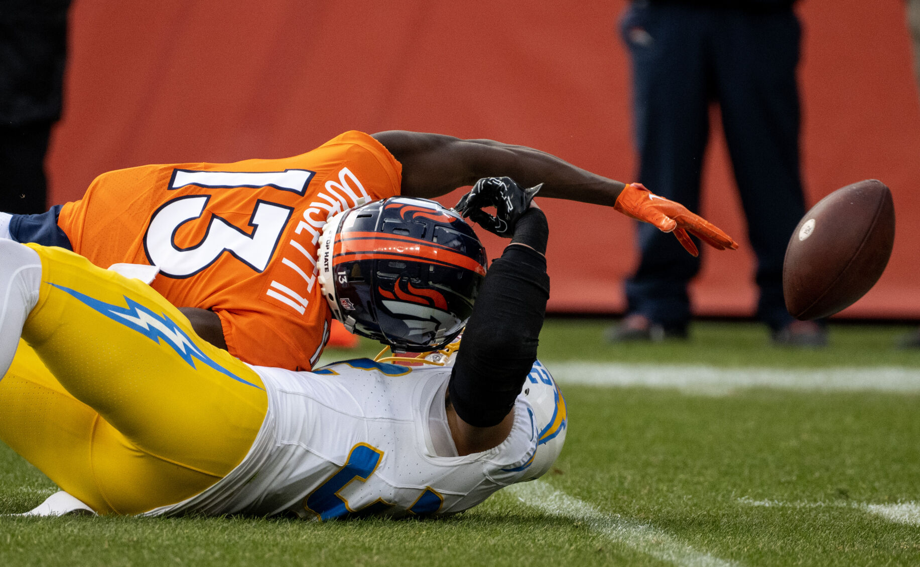 Denver Broncos wide receiver Phillip Dorsett (13) is tackled by Los Angeles Chargers safety Alohi Gilman (32) in the first half of a game on Sunday, Nov. 26, 2023, at Empower Field at Mile High in Denver, Colo. (Parker Seibold, The Gazette) (Parker Seibold)