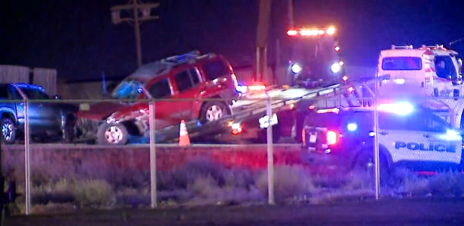 The Toyota Tacoma of an alleged drunk driver is pulled onto a towing truck after the truck plowed into a crash scene and injured four first responders — two police officers and two firefighters — on I-76 Thursday night in Commerce City. (9NEWS)