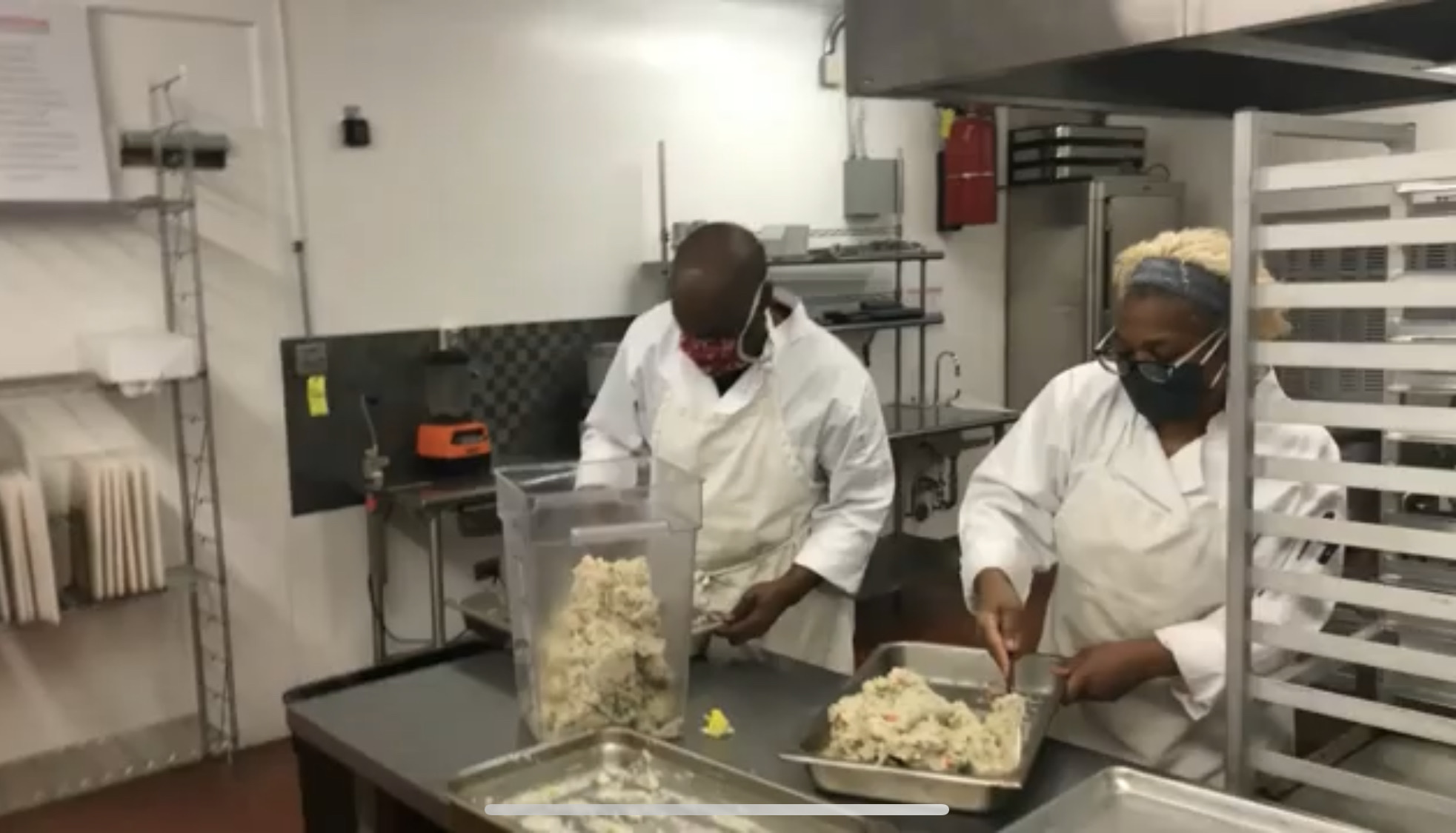 People make food in the Comitis Crisis Center culinary program, which teaches people how to cook and encourages collaboration and communication. (Courtesy of Mile High Behavioral Healthcare)