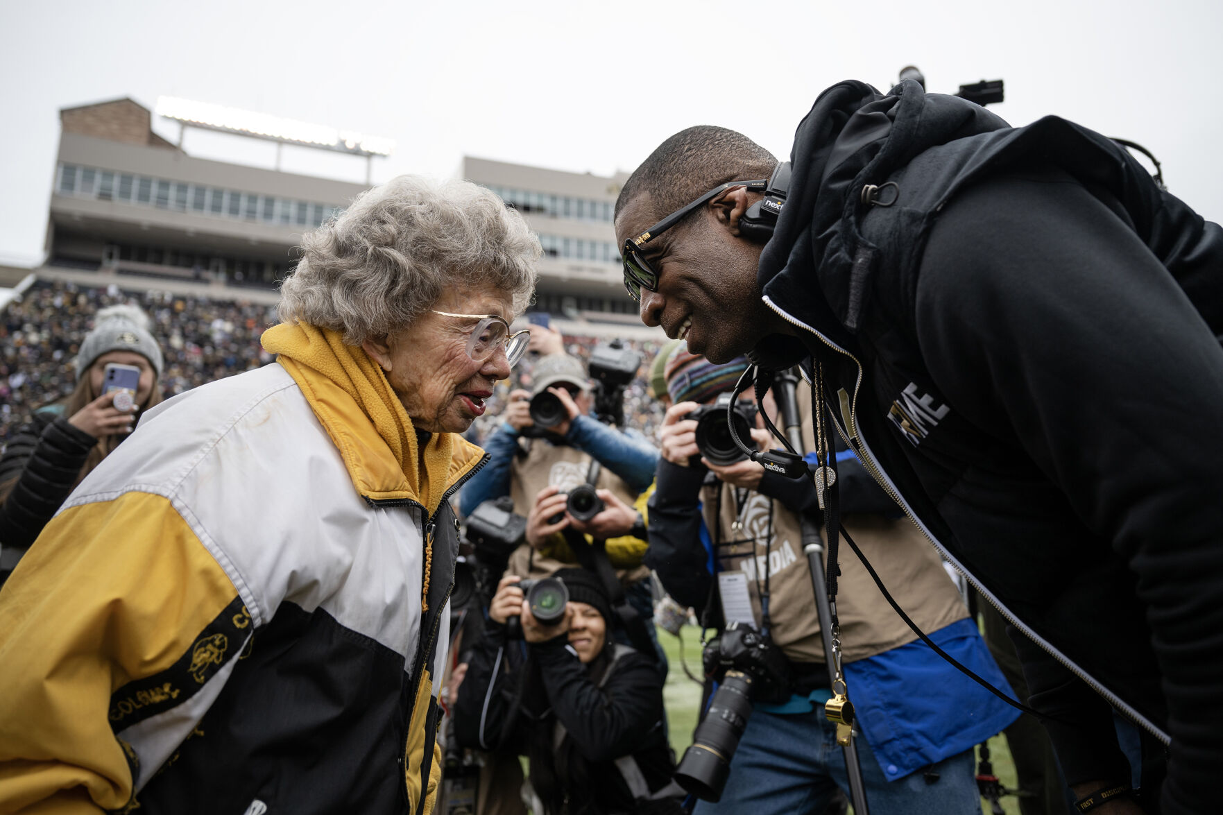 University of Colorado Boulder head coach Deion Sanders greets CU superman Peggy Coppom, 98, before the university’s Black & Gold Day Spring Game on Saturday, April 22, 2023, at Folsom Field in Boulder, Colo. (Timothy Hurst/Denver Gazette) (TimHursttim.hurst@gazette.comhttps://secure.gravatar.com/avatar/aca82bd62b4ee425c598527cd6faa1b1?d=mm&r=g)