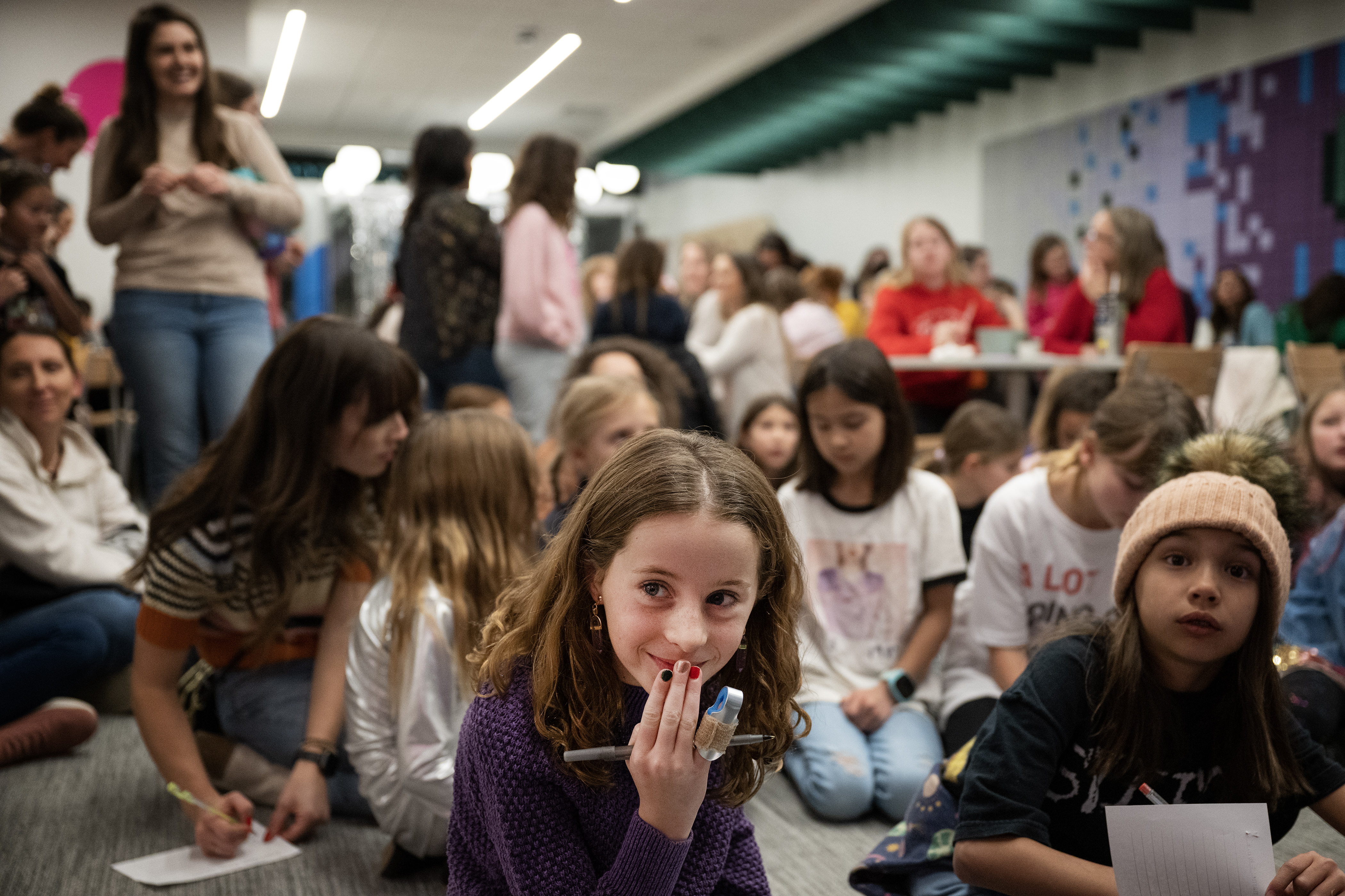 Evelyn Cruz, 8, reacts to a question hint indicating that some of musician Taylor Swifts’ albums may have been released before Cruz and other participants were born, while participating in a trivia contest at the “Mom and Me Swiftie Party!” to celebrate Swift’s birthday, on Tuesday, Dec. 12, 2023, at the Girl Scouts of Colorado DreamLab in Denver, Colo. (Timothy Hurst/Denver Gazette) (TimHursttim.hurst@gazette.comhttps://secure.gravatar.com/avatar/aca82bd62b4ee425c598527cd6faa1b1?d=mm&r=g)