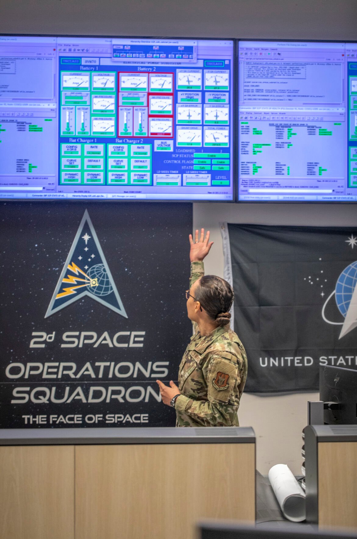 Vehicle systems operator Atheena Reic shows how she works with her team to communicate and maintain the GPS satellites on Saturday. (Gabi Broekema, the gazette)