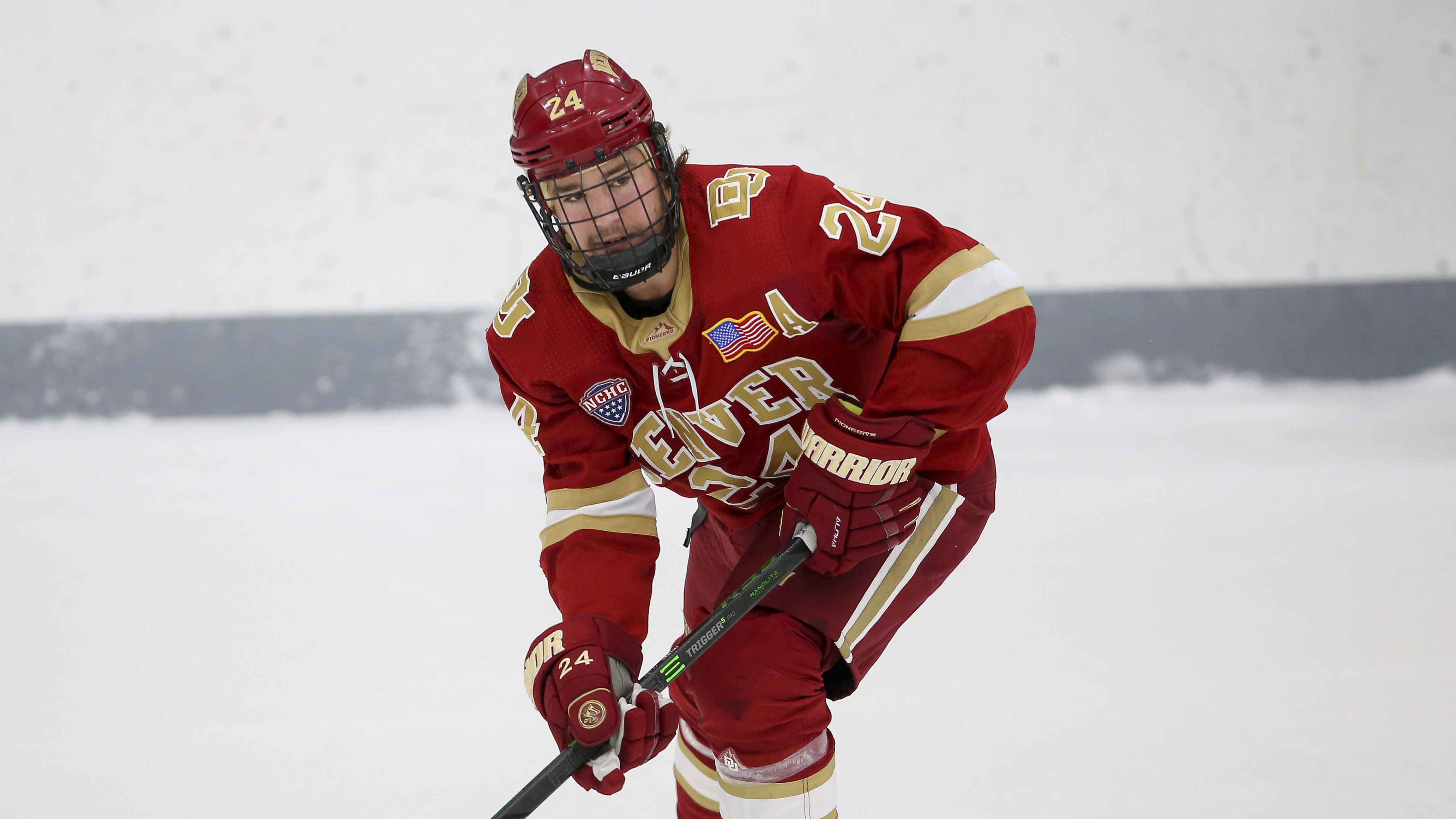 Denver's Bobby Brink (24) skates during the second period of an NCAA hockey game against Providence on Friday, Oct. 22, 2021, in Providence, R.I. (AP Photo/Stew Milne) (Stew Milne)
