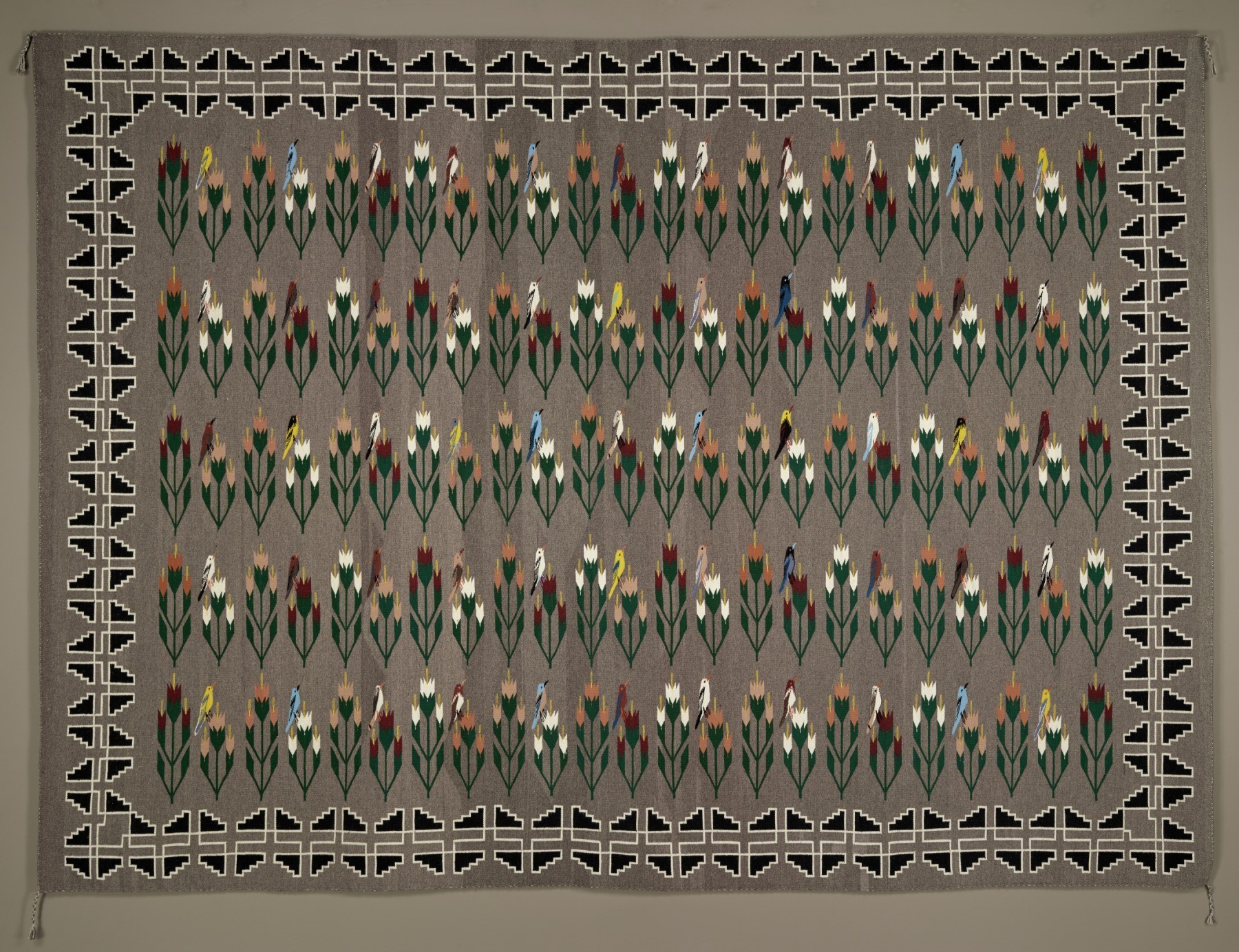 Ason Yellowhair (Navajo, c. 1930-2013), Bird and Cornstalk Rug, 1983. Wool and dye; 94 x 131 in. The Gloria F. Ross Collection of Contemporary Navajo Weaving at the Denver Art Museum, 1984.4 (Courtesy photo, Denver Art Museum)