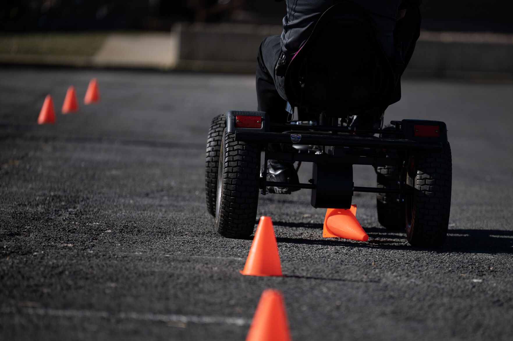Colorado State Patrol master trooper Gary Cutler runs over a cone while attempting to drive a pedal cart through a slalom course while wearing goggles that simulate a .26 to .35 blood alcohol content level during a demonstration to media of the difficulty driving while impaired on Wednesday, Dec. 6, 2023, in the parking lot outside the Colorado State Patrol Academy in Golden Colo. (Timothy Hurst/Denver Gazette) (TimHursttim.hurst@gazette.comhttps://secure.gravatar.com/avatar/aca82bd62b4ee425c598527cd6faa1b1?d=mm&r=g)