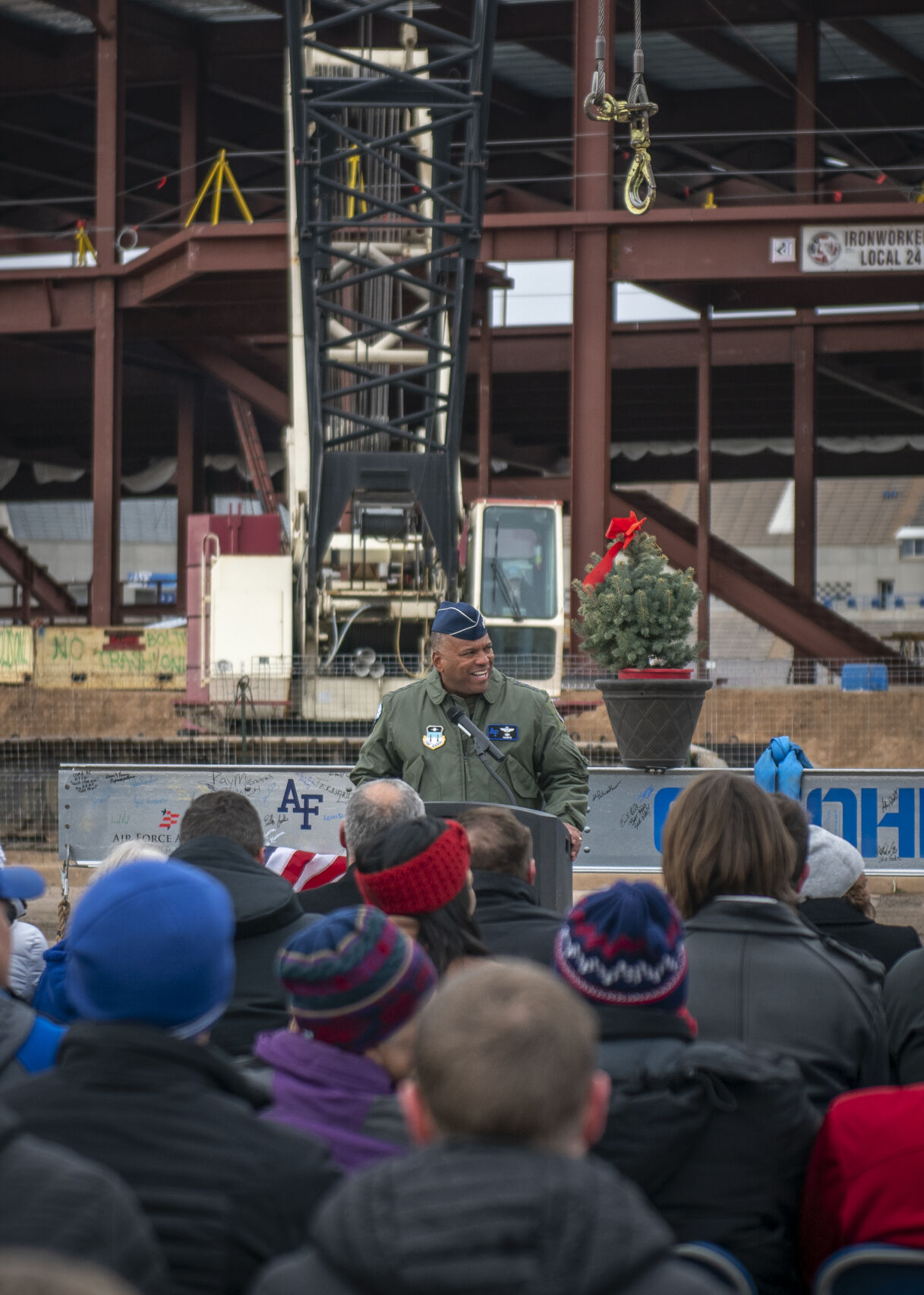 Air Force Academy superintendent Lt. Gen. Richard M. Clark makes a quick speech as to minimize the attendees time in the biting cold before the final beam is placed on the construction of the East Club at Falcon Stadium at Air Force Academy on Friday, December 8, 2023. (Gabi Broekema)