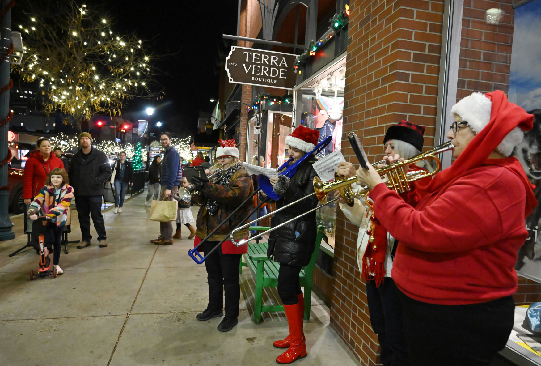 The all-ladies Christmas Brass performs for shoppers taking advantage of mild December temperatures for the Holiday Stroll in downtown Colorado Springs on Wednesday, Dec. 6, 2023. (Photo by Jerilee Bennett, The Gazette)