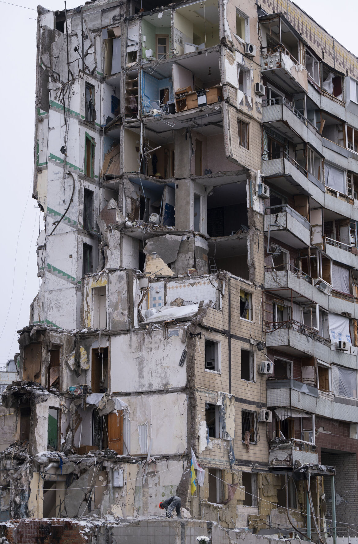 A worker saws the broken cement at an apartment building in Dnipro, Ukraine, Monday, that was attacked by the Russians earlier this year on Jan. 14. The attack killed 46, including six children, and injured 80 people. Eight are still missing. (Christian Murdock, The Gazette)