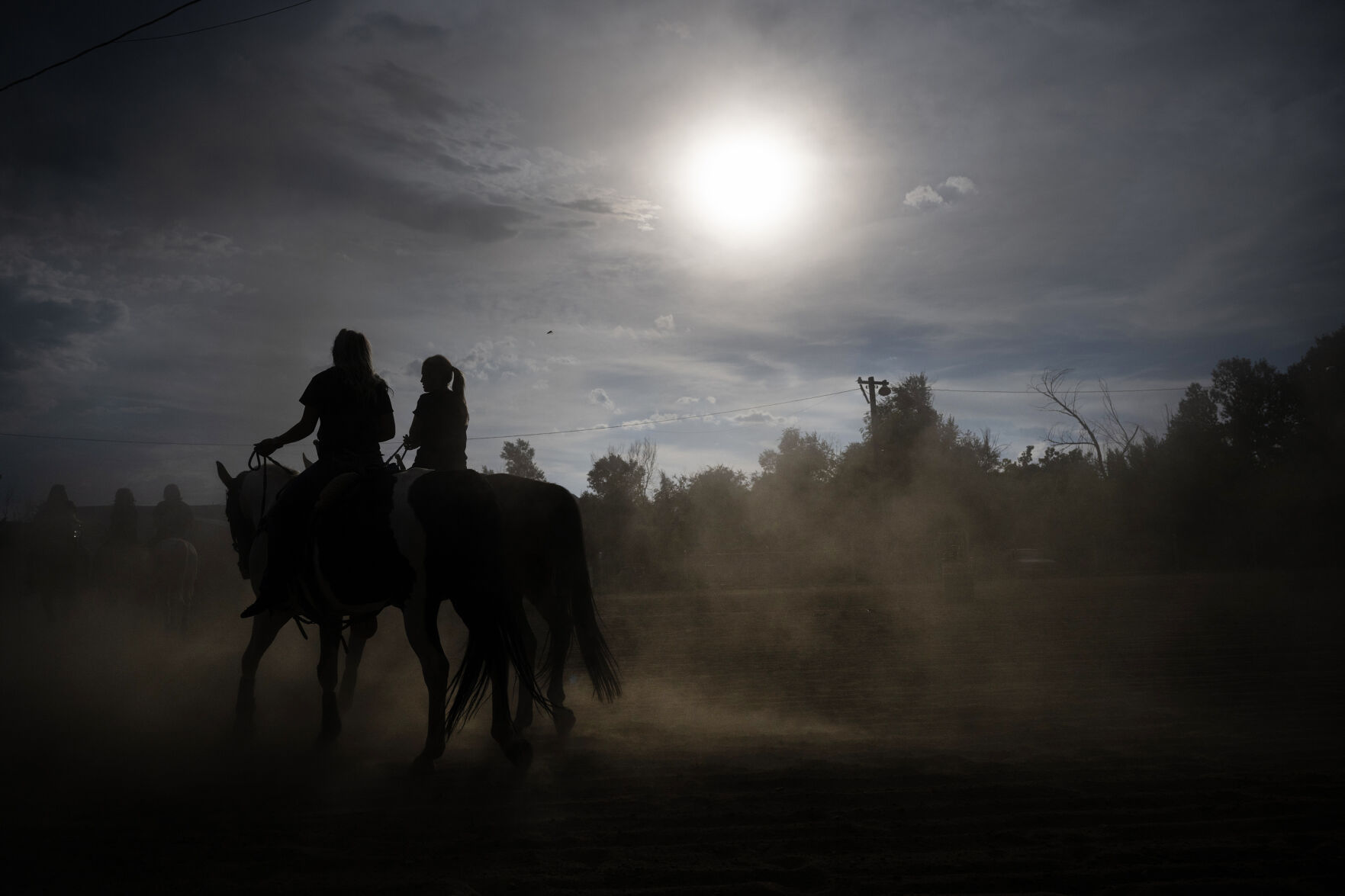 Trick riders Kora Porter, left, and Kayla McDonald ride through a cloud of dust as they and the rest of the Shockwave Trick Riders team warm their horses up during a practice session on Monday, July 24, 2023, at Prospect Arena in Arvada, Colo. (Timothy Hurst/Denver Gazette) (TimHursttim.hurst@gazette.comhttps://secure.gravatar.com/avatar/aca82bd62b4ee425c598527cd6faa1b1?d=mm&r=g)