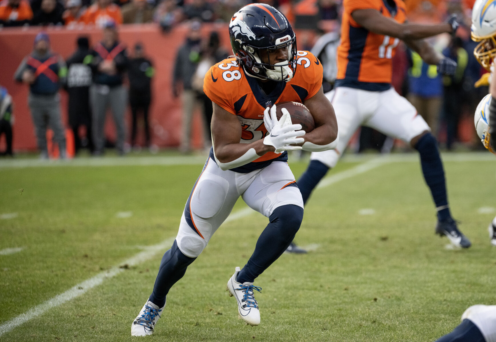 Denver Broncos running back Jaleel McLaughlin (38) carries the ball in the first half of a game on Sunday, Nov. 26, 2023, at Empower Field at Mile High in Denver, Colo. (Parker Seibold, The Gazette) (Parker Seibold)