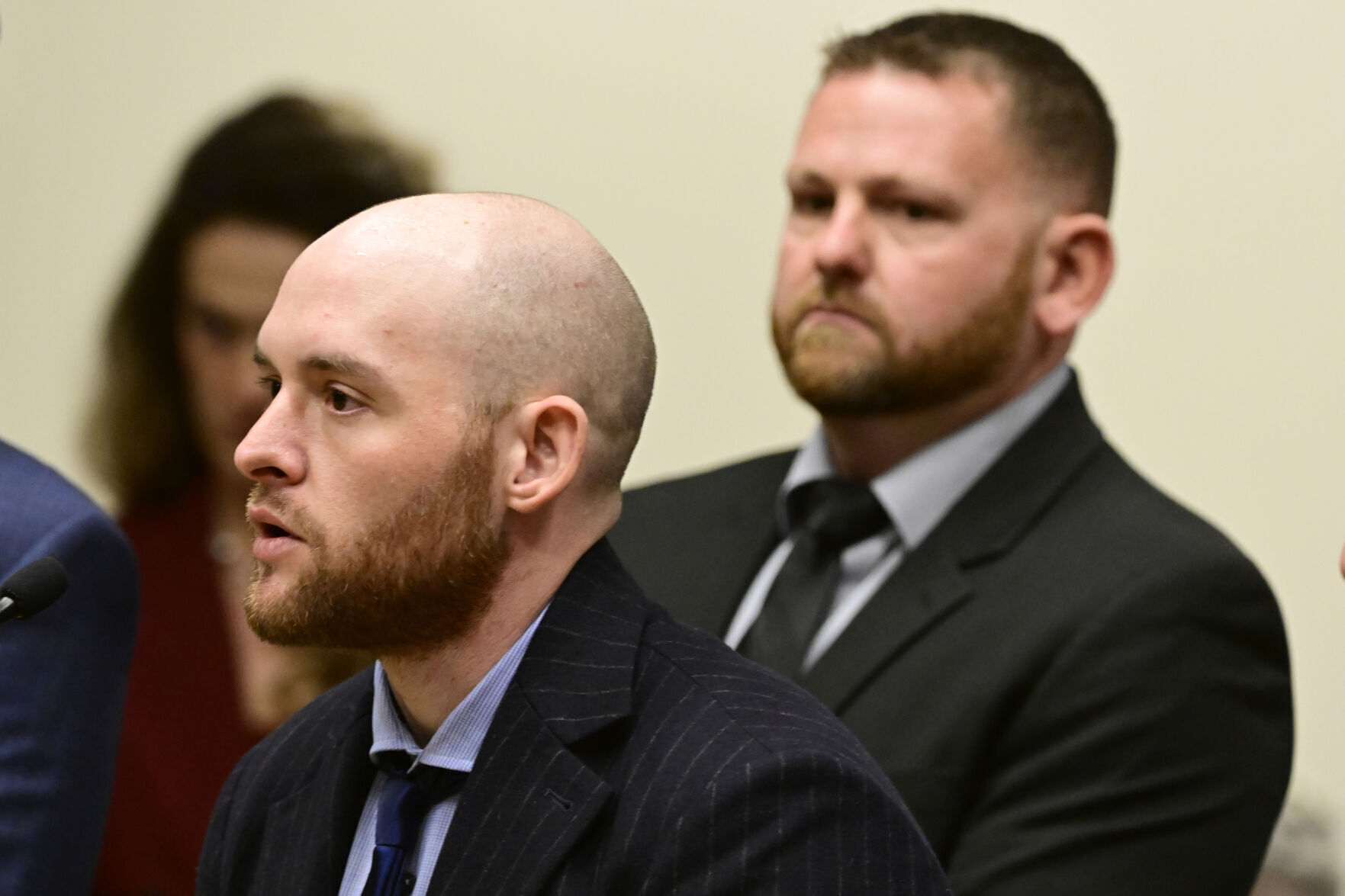 Former Aurora Officer Jason Rosenblatt, left, and Aurora Police Officer Randy Roedema, right, attend an arraignment at the Adams County Justice Center in Brighton on Jan. 20. (the associated press)