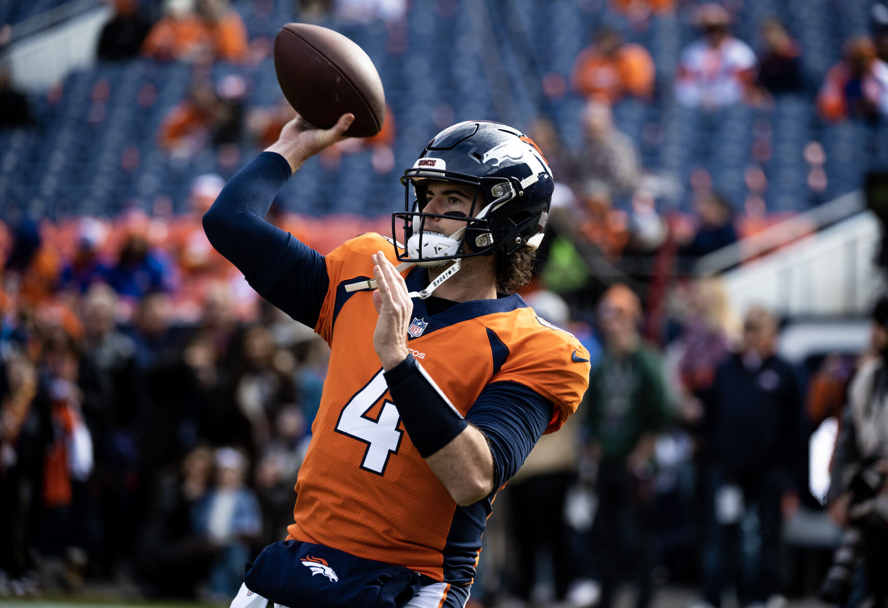 Denver Broncos quarterback Jarrett Stidham (4) warms up before a game against the Los Angeles Chargers on Sunday, Nov. 26, 2023, at Empower Field at Mile High in Denver, Colo. (Parker Seibold, The Gazette) (Parker Seibold)