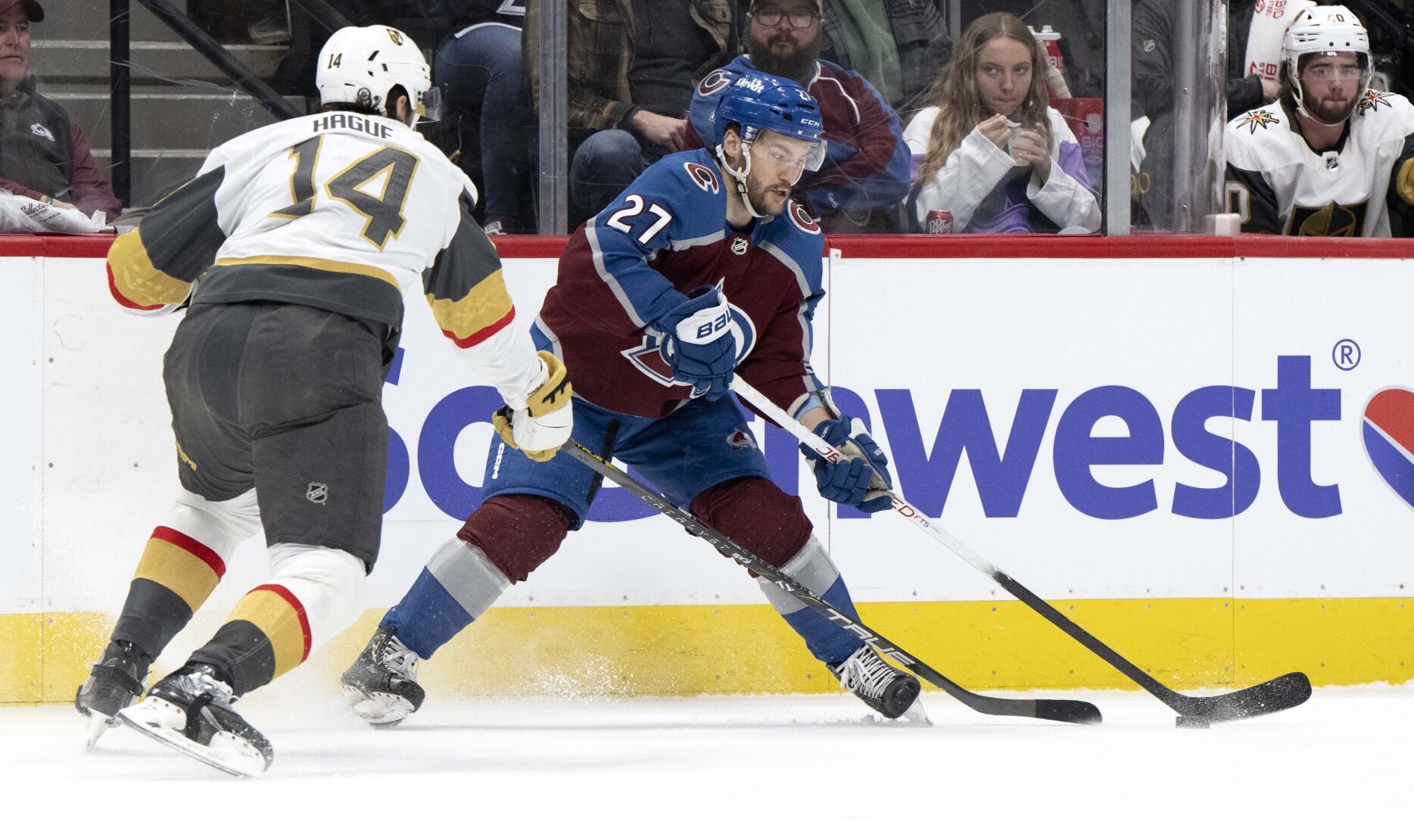 Colorado Avalanche left wing Jonathan Drouin (27) passes to a teammates as Vegas Golden Knights defenseman Nicolas Hague (14) defends during the first period Wednesday, Jan. 10, 2024, at Ball Arena in Denver. (The Gazette, Christian Murdock) (Christian Murdock/The Gazette)