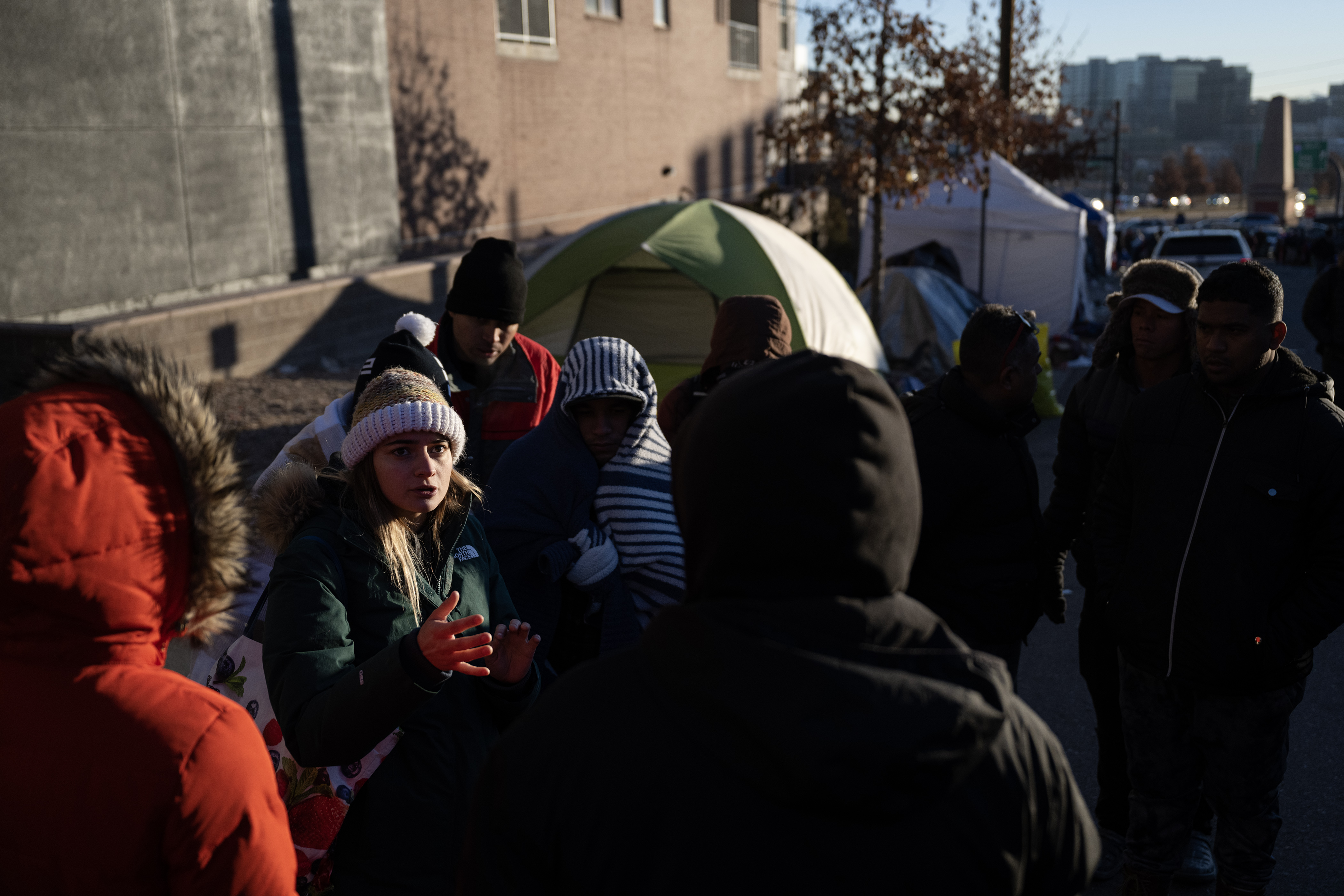 V, with Housekeeps Action Network Denver, talks with immigrants during an encampment sweep at West 27th Avenue, between Zuni and Alcott Streets on Wednesday, Jan. 3, 2024, in Denver, Colo. (Timothy Hurst/Denver Gazette) (TimHursttim.hurst@gazette.comhttps://secure.gravatar.com/avatar/aca82bd62b4ee425c598527cd6faa1b1?d=mm&r=g)