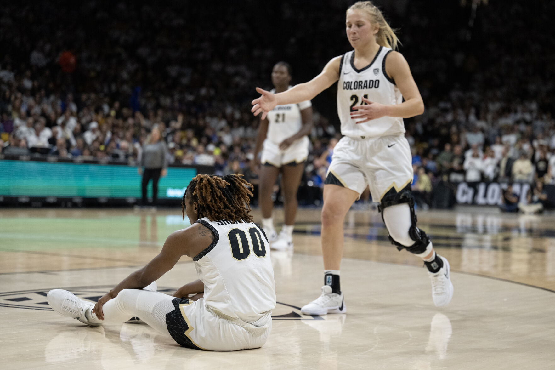 Colorado Buffaloes guard Maddie Nolan (24) rushes over to help guard Jaylyn Sherrod (0) after a hard fall to the court during a game against the UCLA Bruins on Friday, Jan. 19, 2024, at the CU Event Center in Boulder, Colo.(Timothy Hurst/Denver Gazette) (TimHursttim.hurst@gazette.comhttps://secure.gravatar.com/avatar/aca82bd62b4ee425c598527cd6faa1b1?d=mm&r=g)