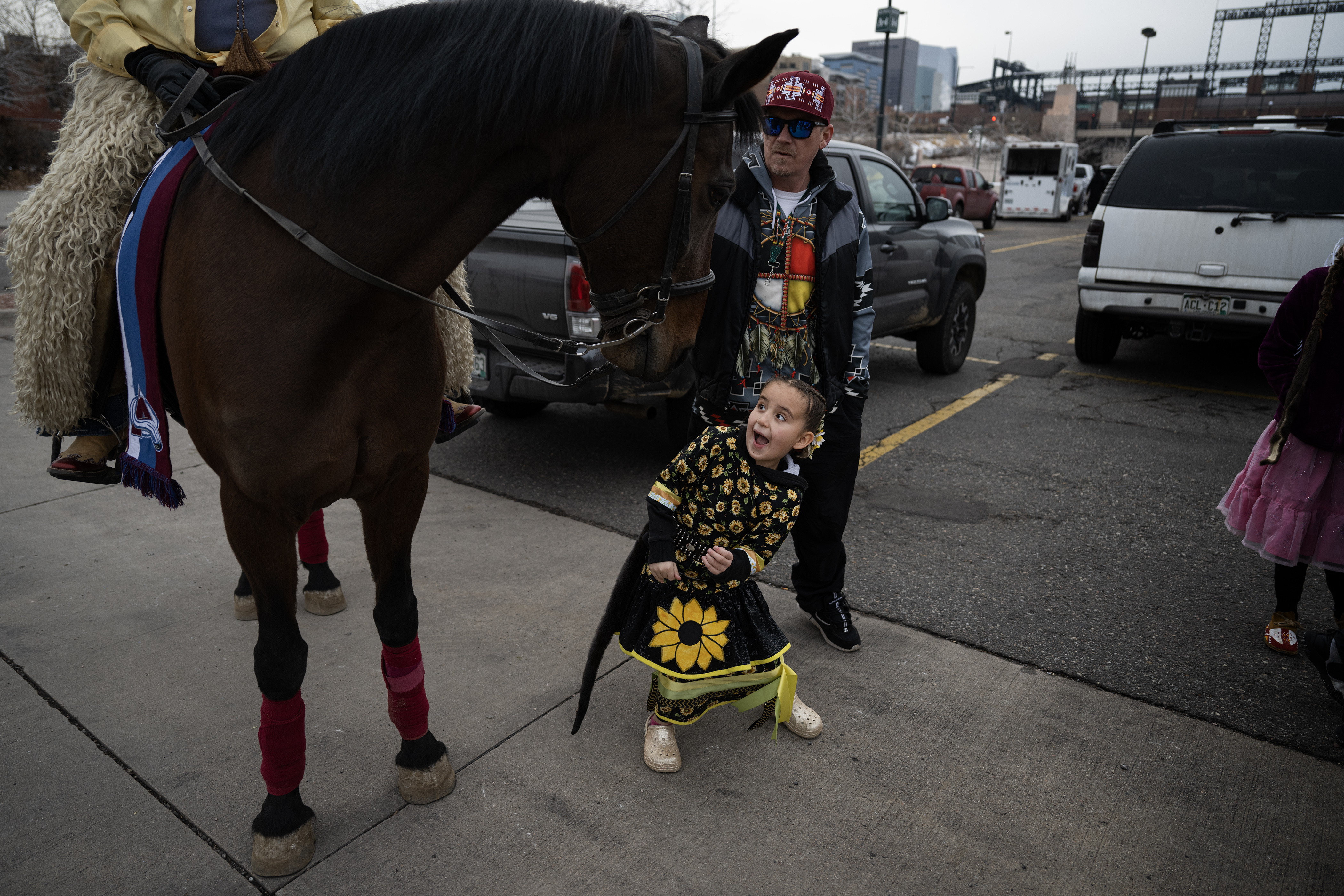 Sage Kirby Yellow Horse, 6, of the Oglala Lakota Nation and the Rocky Mountain Indigenous Dancers, reacts as Lydia Andrews-Jones’ horse Sophie turns to Sage after getting a pet before The National Western Stock Show Kick-off Parade on Thursday, Jan. 4, 2024, in Denver, Colo. (Timothy Hurst/Denver Gazette) (TimHursttim.hurst@gazette.comhttps://secure.gravatar.com/avatar/aca82bd62b4ee425c598527cd6faa1b1?d=mm&r=g)