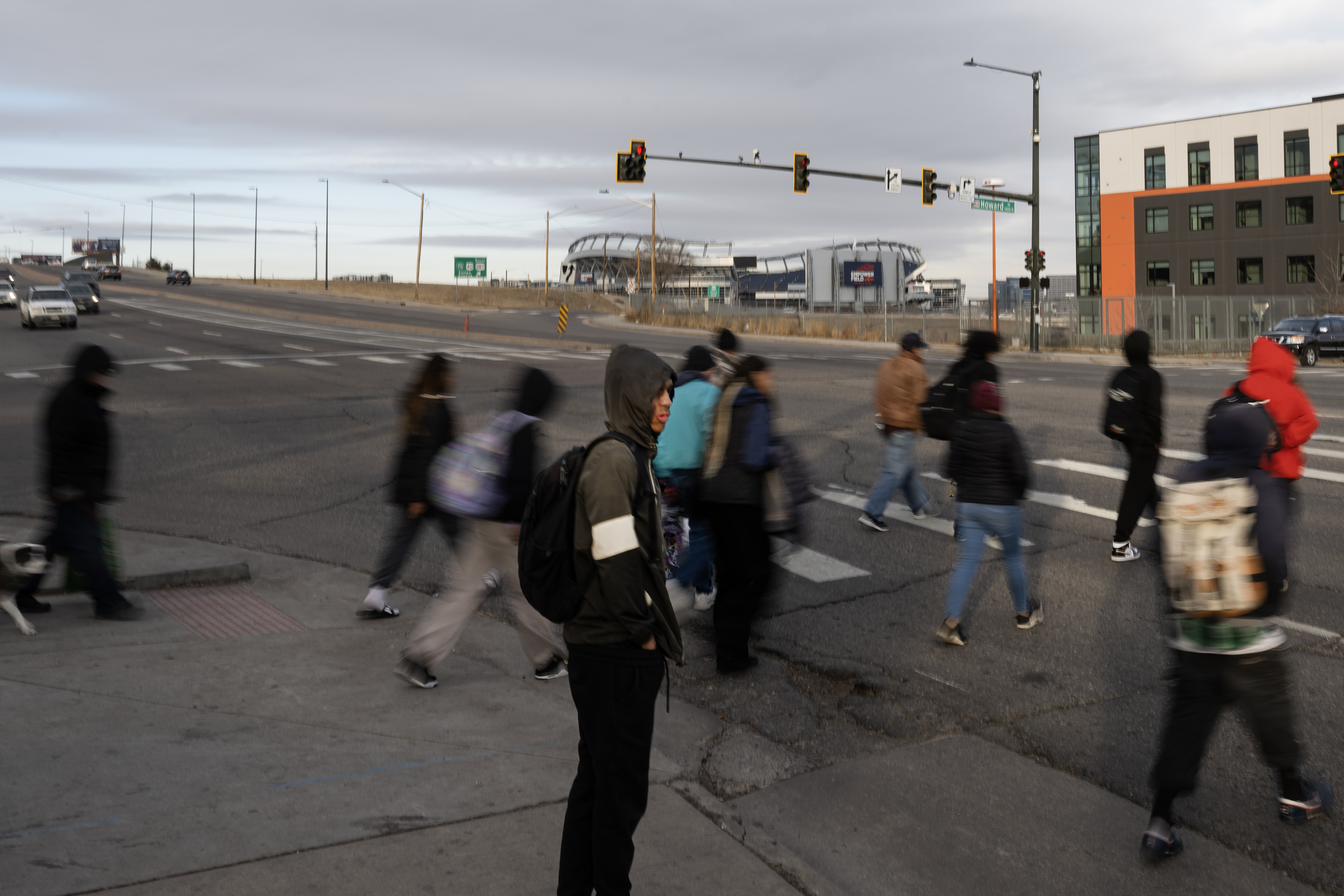 A group of pedestrian cross Federal Boulevard at West Howard Place, one of the deadliest intersections for pedestrians in Denver, on Thursday, Jan. 11, 2024. (Timothy Hurst/Denver Gazette) (Timothy Hurst/The Gazette)