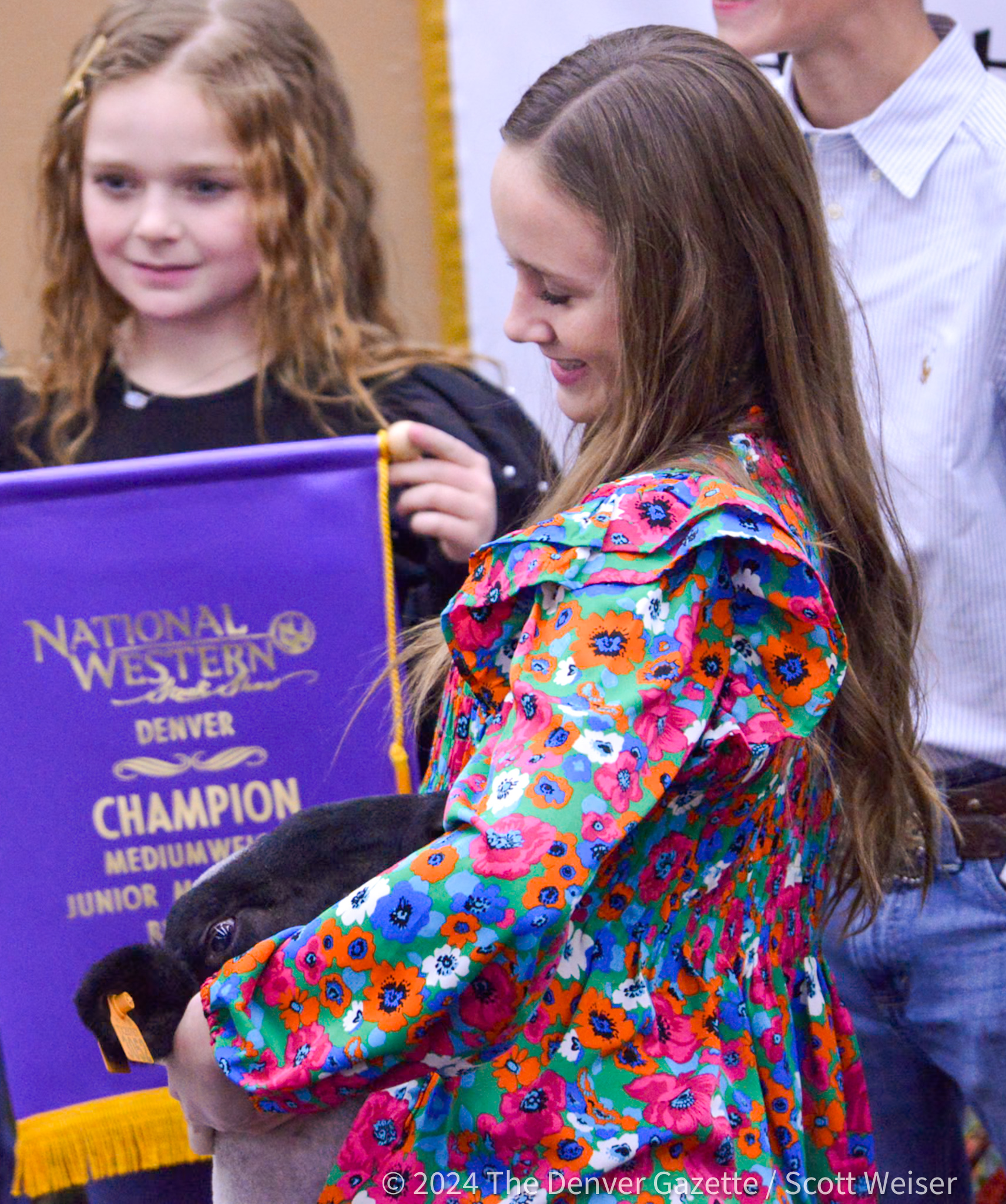 Kinley Pruett, 13, of Elk City, Oklahoma, looks at her lamb Colby at the Grand Champion livestock auction at the 2024 National Western Stock Show in Denver Jan. 10, 2024.Colby, the NWSS 2024 Grand Champion sold for $52,000 to APC Resources.Kinley plans to study animal science and become a veterinarian. (ScottWeiserEnterprise Reporterscott.weiser@gazette.comhttps://secure.gravatar.com/avatar/bedf4ba0a073402c3991ce97ce2869c4?d=mm&r=g)