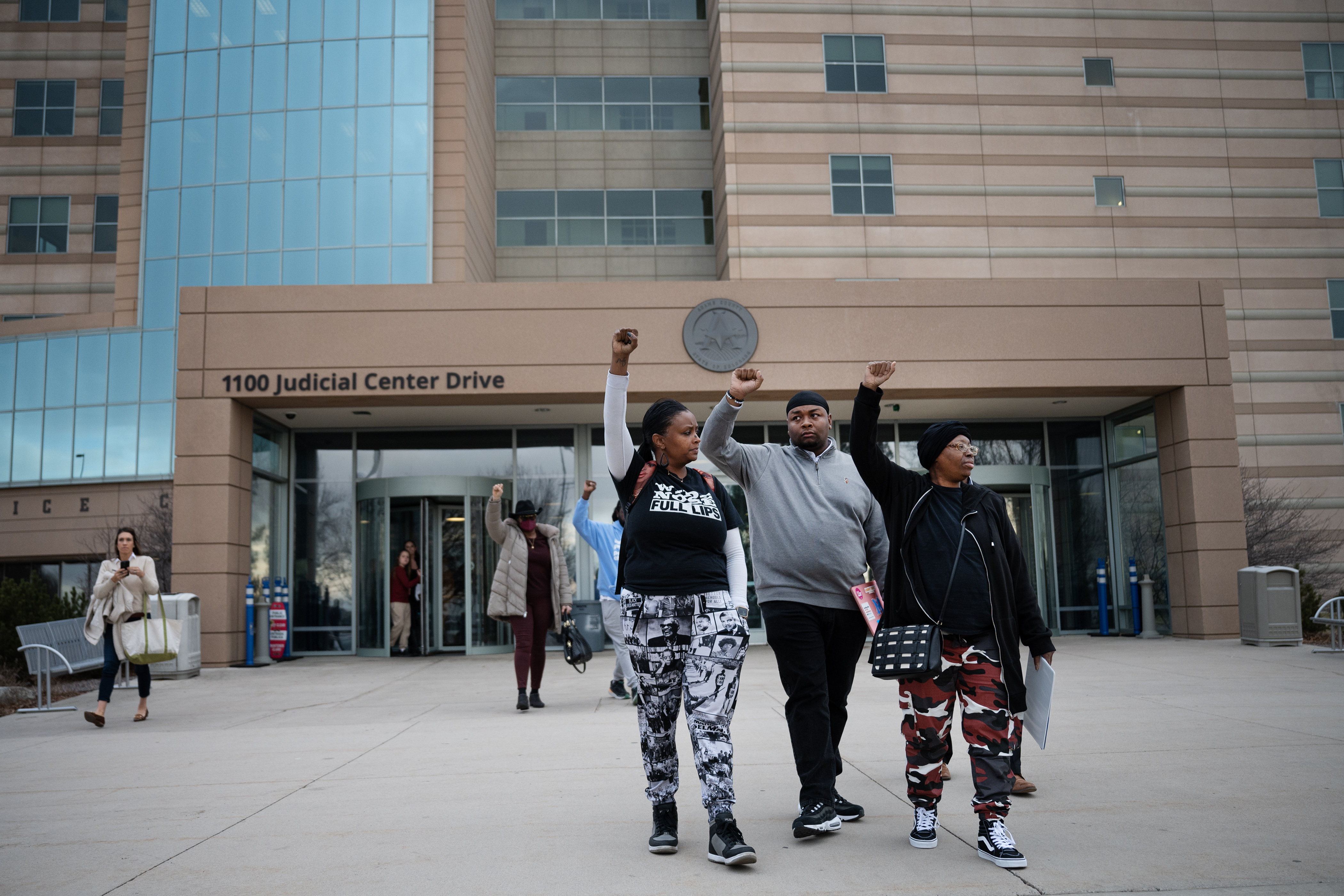 Sheneen McClain, right, the mother of Elijah McClain, walks out of the courthouse with her fist raised along with MiDian Holmes, left, and Auon'tai Anderson, following the sentencing of former Aurora police Officer Randy Roedema for his role in the 2019 killing of McClain’s son, on Friday, Jan. 5, 2024, at the Adams County Court in in Brighton, Colo. (Timothy Hurst/Denver Gazette) (TimHursttim.hurst@gazette.comhttps://secure.gravatar.com/avatar/aca82bd62b4ee425c598527cd6faa1b1?d=mm&r=g)