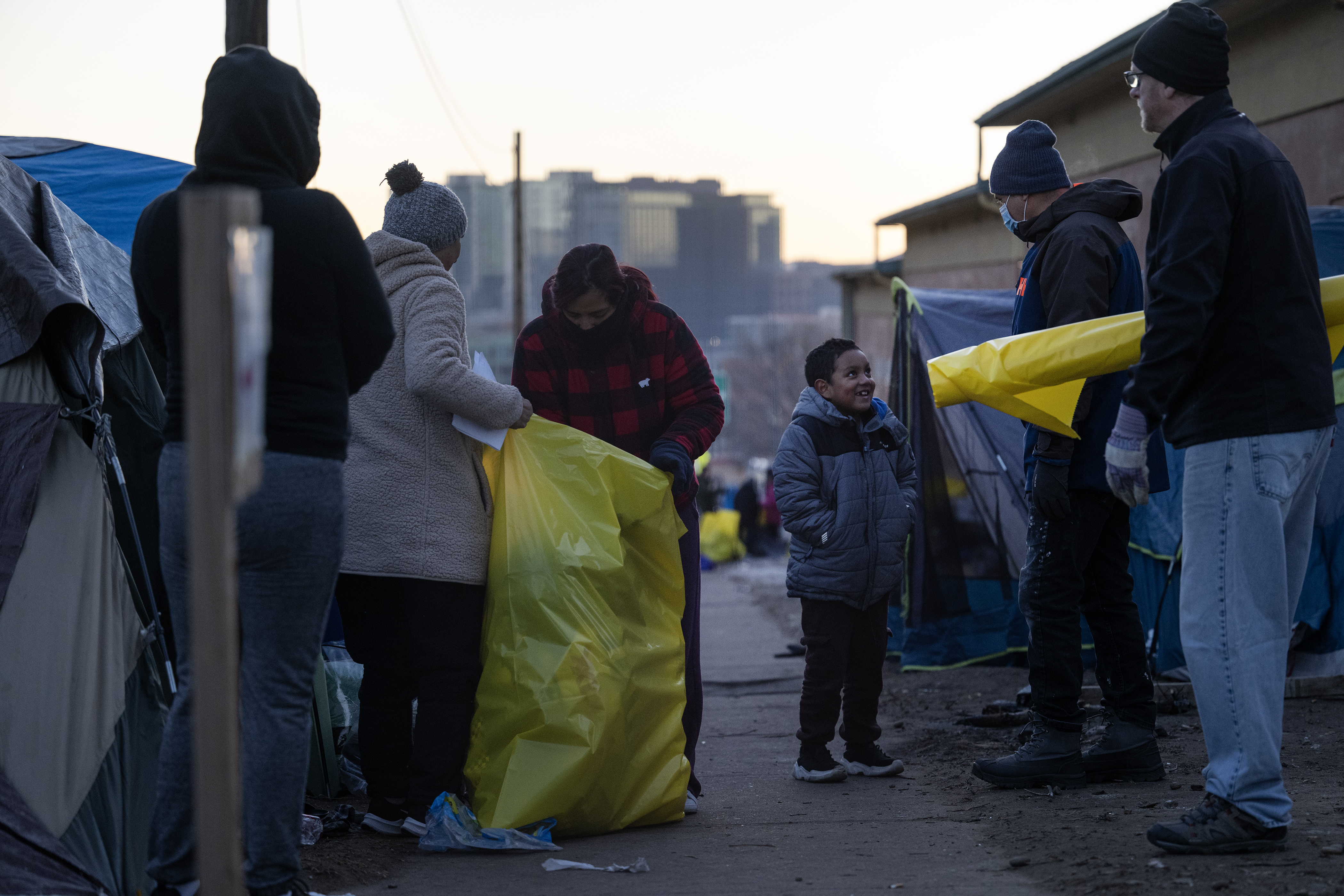 Immigrants pack up their belongings during an encampment sweep at West 27th Avenue, between Zuni and Alcott Streets on Wednesday, Jan. 3, 2024, in Denver, Colo. (Timothy Hurst/Denver Gazette) (TimHursttim.hurst@gazette.comhttps://secure.gravatar.com/avatar/aca82bd62b4ee425c598527cd6faa1b1?d=mm&r=g)