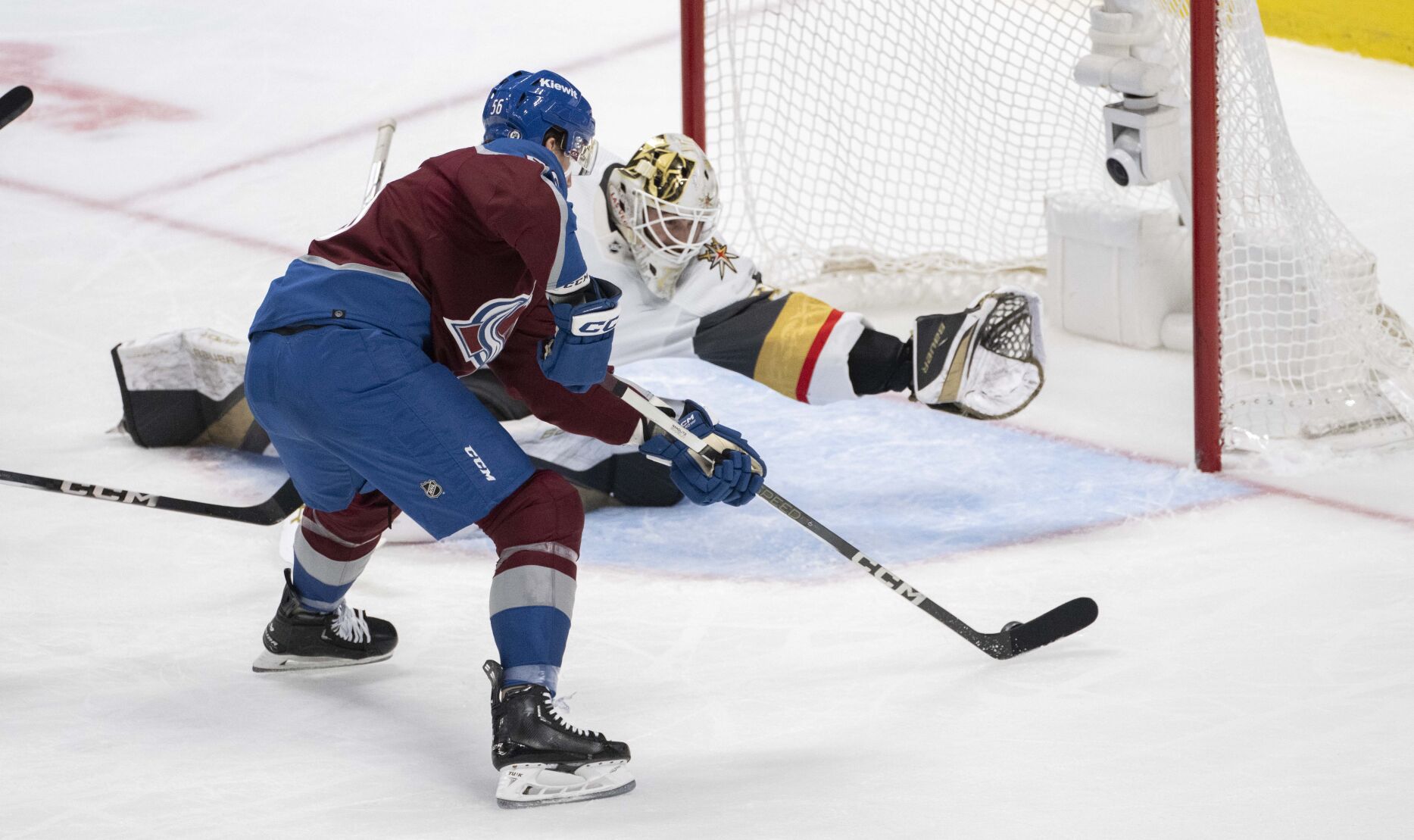 Vegas Golden Knights goaltender Jiri Patera (30) dives for a save on a shot by Colorado Avalanche defenseman Kurtis MacDermid (56) during the second period Wednesday, Jan. 10, 2024, at Ball Arena in Denver. (The Gazette, Christian Murdock) (Christian Murdock/The Gazette)