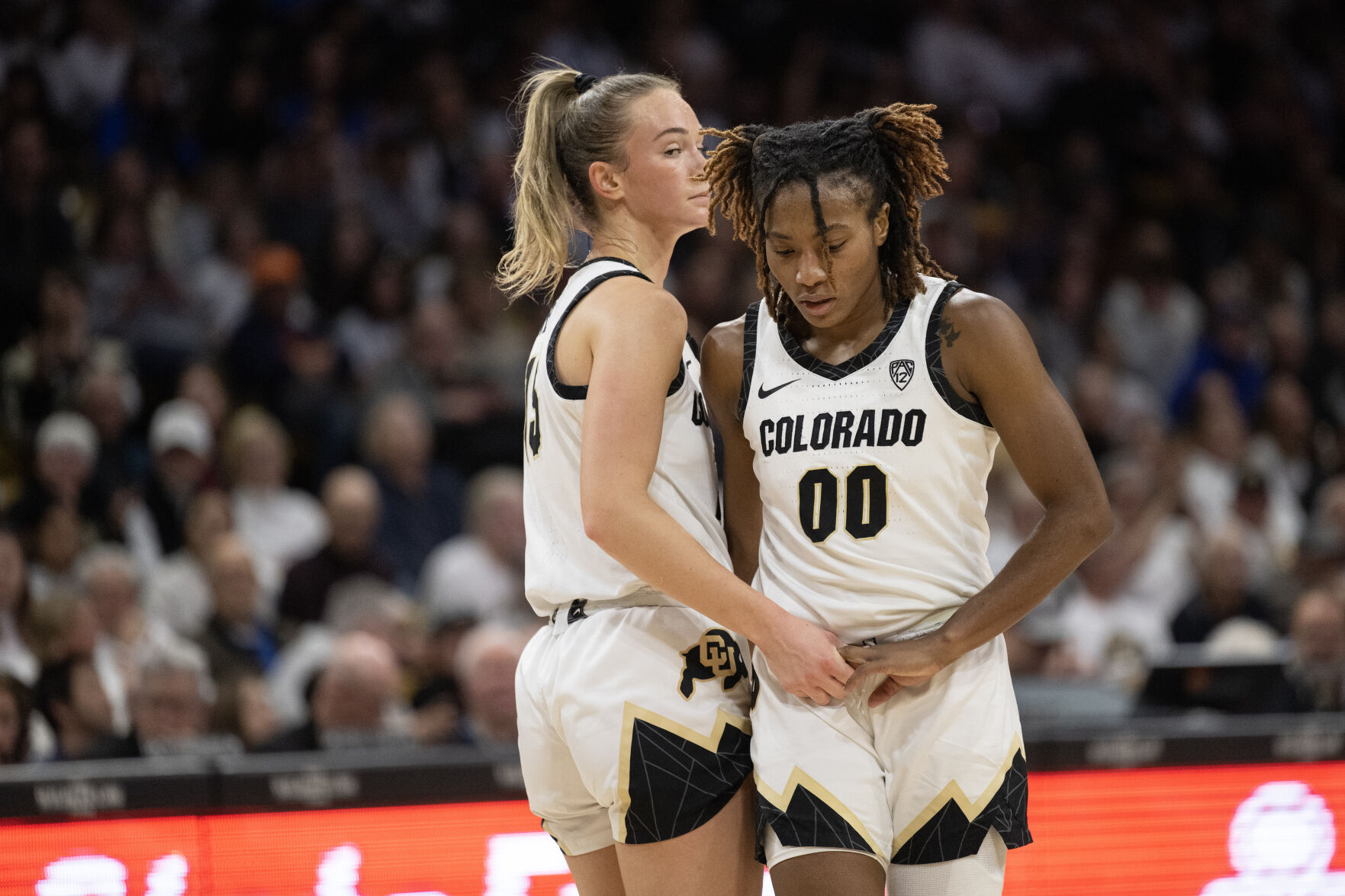 Colorado Buffaloes guard Kindyll Wetta (15) checks on Colorado Buffaloes guard Jaylyn Sherrod (0) after Sherrod took a hard fall, left the court, and then reentered the game against the UCLA Bruins on Friday, Jan. 19, 2024, at the CU Event Center in Boulder, Colo.(Timothy Hurst/Denver Gazette) (TimHursttim.hurst@gazette.comhttps://secure.gravatar.com/avatar/aca82bd62b4ee425c598527cd6faa1b1?d=mm&r=g)