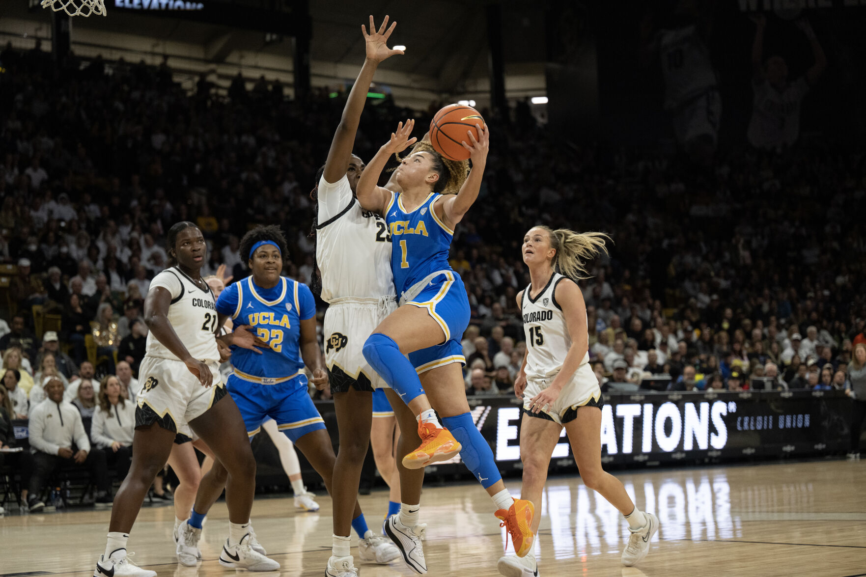 UCLA Bruins guard Kiki Rice (1) goes up against Colorado Buffaloes forward Brianna McLeod (25) on Friday, Jan. 19, 2024, at the CU Event Center in Boulder, Colo.(Timothy Hurst/Denver Gazette) (TimHursttim.hurst@gazette.comhttps://secure.gravatar.com/avatar/aca82bd62b4ee425c598527cd6faa1b1?d=mm&r=g)