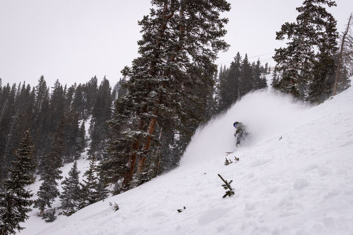 A snowboarder puffs up fresh snow on terrain in the Pallavincini zone Wednesday, Jan. 10, 2024 at Arapahoe Basin Ski Area in Dillon, Colorado. (Lucas Herbert, Arapahoe Basin Ski Area)