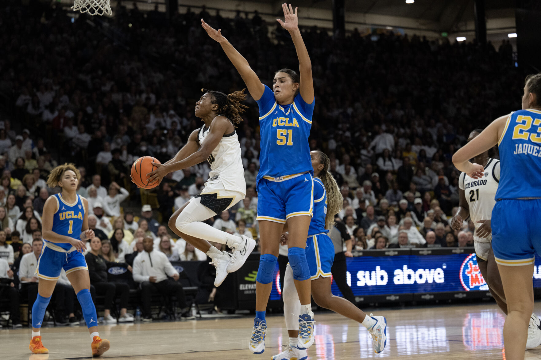 Colorado Buffaloes guard Jaylyn Sherrod (0) gets a layup past UCLA Bruins center Lauren Betts (51) on Friday, Jan. 19, 2024, at the CU Event Center in Boulder, Colo.(Timothy Hurst/Denver Gazette) (TimHursttim.hurst@gazette.comhttps://secure.gravatar.com/avatar/aca82bd62b4ee425c598527cd6faa1b1?d=mm&r=g)