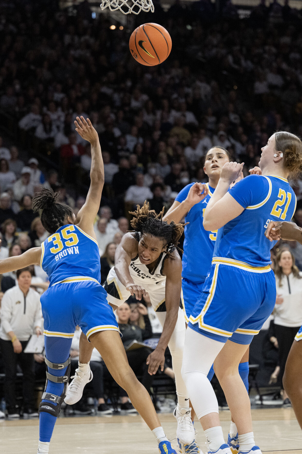 Colorado Buffaloes guard Jaylyn Sherrod (0) draws the foul against the Colorado Buffaloes center Aaronette Vonleh (21) on Friday, Jan. 19, 2024, at the CU Event Center in Boulder, Colo.(Timothy Hurst/Denver Gazette) (TimHursttim.hurst@gazette.comhttps://secure.gravatar.com/avatar/aca82bd62b4ee425c598527cd6faa1b1?d=mm&r=g)