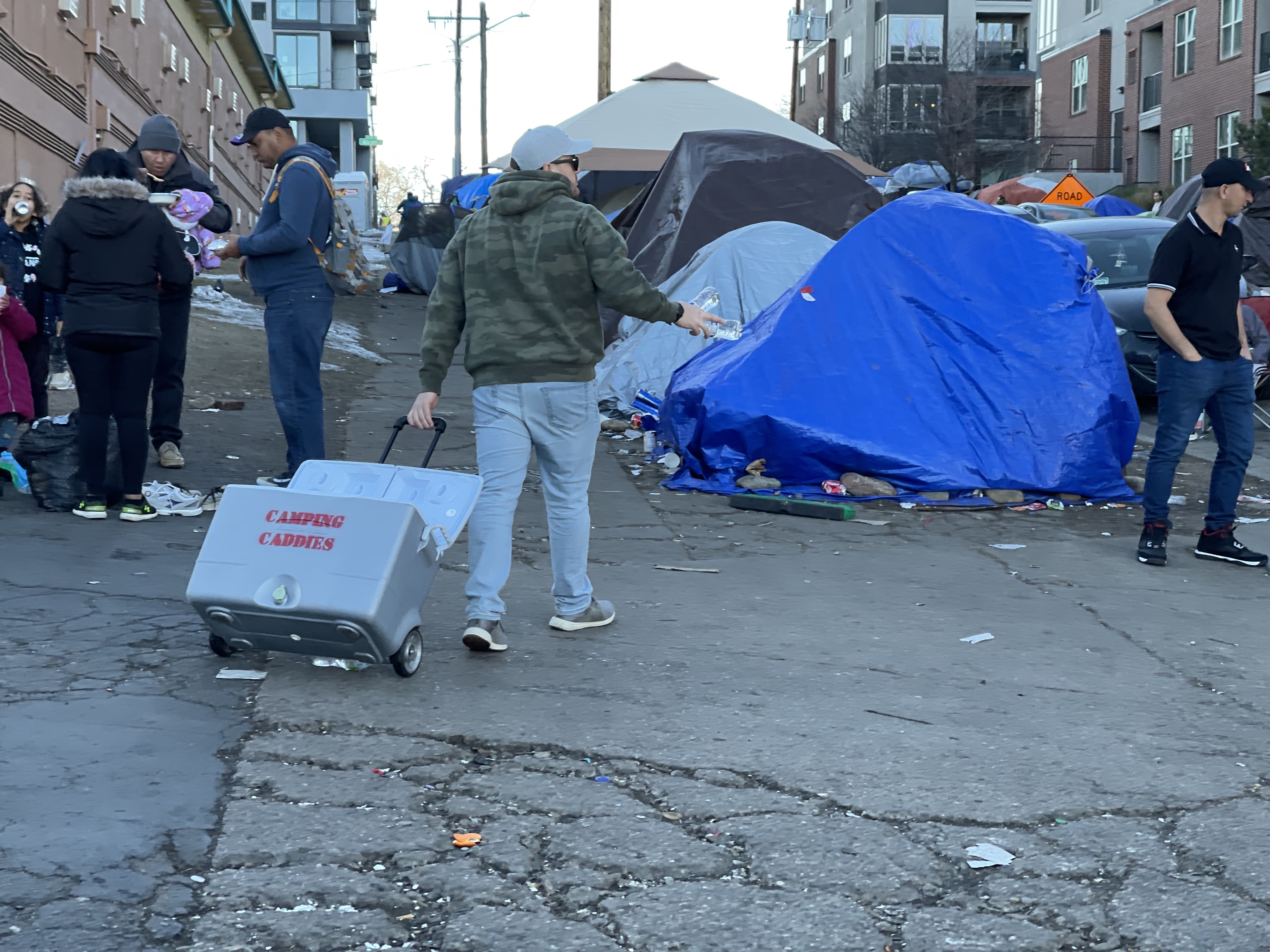 A concerned resident hands out free bottles of water on Dec. 29, 2023 at a camp housing homeless immigrants. (NicoBrambilanico.brambila@denvergazette.comhttps://denvergazette.com/content/tncms/avatars/4/ec/74a/4ec74aa2-71b0-11ed-af6f-0f0ae7acf7b0.d52fca74e95503d77da50127c9ff4e2d.png)