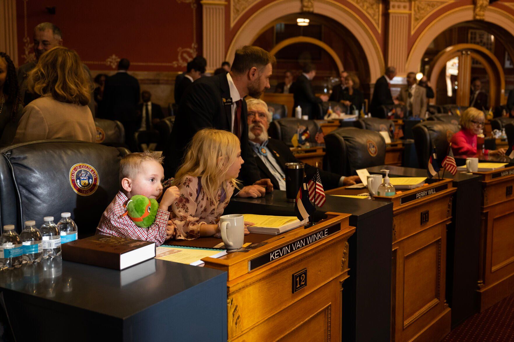 Sen. Kevin Van Winkle’s children Jack, 4, and Hailey, 7, look on from their fathers desk in the Senate chambers before convening for the first day of Colorado's 2024 legislative session at the Colorado State Capitol building on Wednesday, Jan. 10, 2024, in Denver, Colo.(Timothy Hurst/Denver Gazette) (TimHursttim.hurst@gazette.comhttps://secure.gravatar.com/avatar/aca82bd62b4ee425c598527cd6faa1b1?d=mm&r=g)