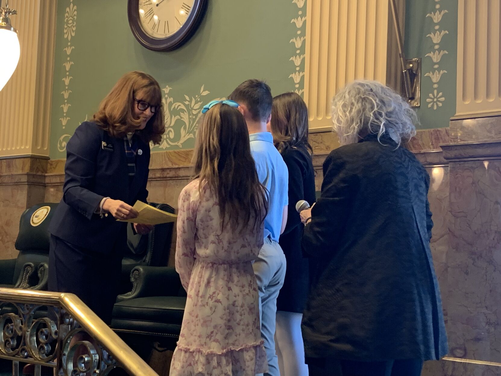 House Speaker Julie McCluskie, D-Dillon, thanks the grandchildren of the late Colorado photographer John Fielder for leading the House in the Pledge of Allegiance, Wednesday, Jan. 9, 2024. (MarianneGoodlandmarianne.goodland@coloradopolitics.comhttps://secure.gravatar.com/avatar/125a14b7bd9266f61a445ec13b1d3605?d=mm&r=g)