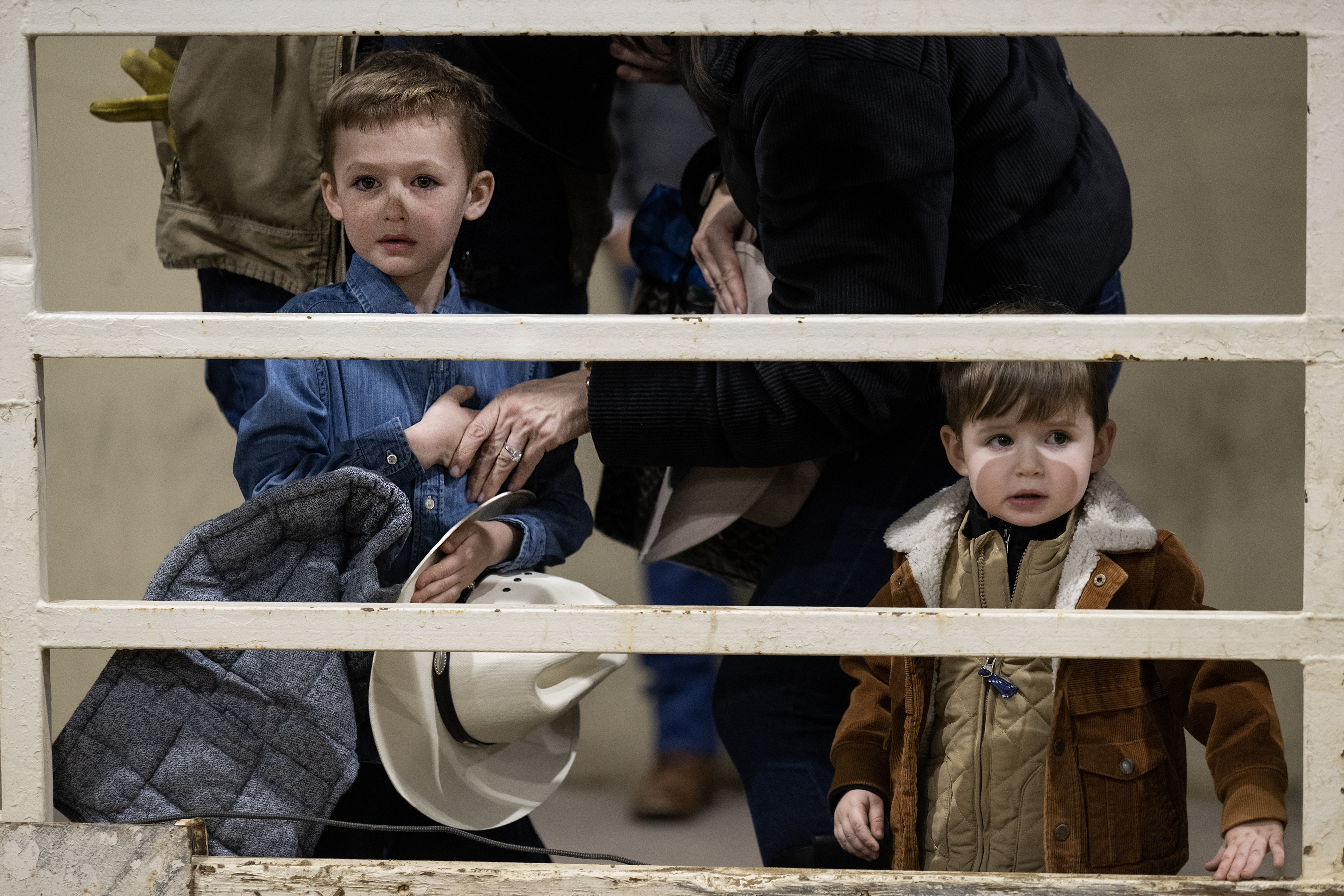 Mother Pam Poulin places her five-year-old son Henry Poulin’s hand on his heart during the Star Spangled Banner before the Stadium Arena Mutton Bustin’ event on Monday, Jan. 8, 2024, at the National Western Complex in Denver, Colo. (Timothy Hurst/Denver Gazette) (TimHursttim.hurst@gazette.comhttps://secure.gravatar.com/avatar/aca82bd62b4ee425c598527cd6faa1b1?d=mm&r=g)