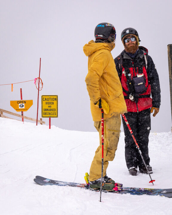 A skier talks with a ski patroller above terrain near the Pallavicini zone Wednesday, Jan. 10, 2024 at Arapahoe Basin Ski Area in Dillon, Colorado. Pallavicini zone terrain opened for the first time for the 2023-24 winter Wednesday. (Lucas Herbert, Arapahoe Basin Ski Area)