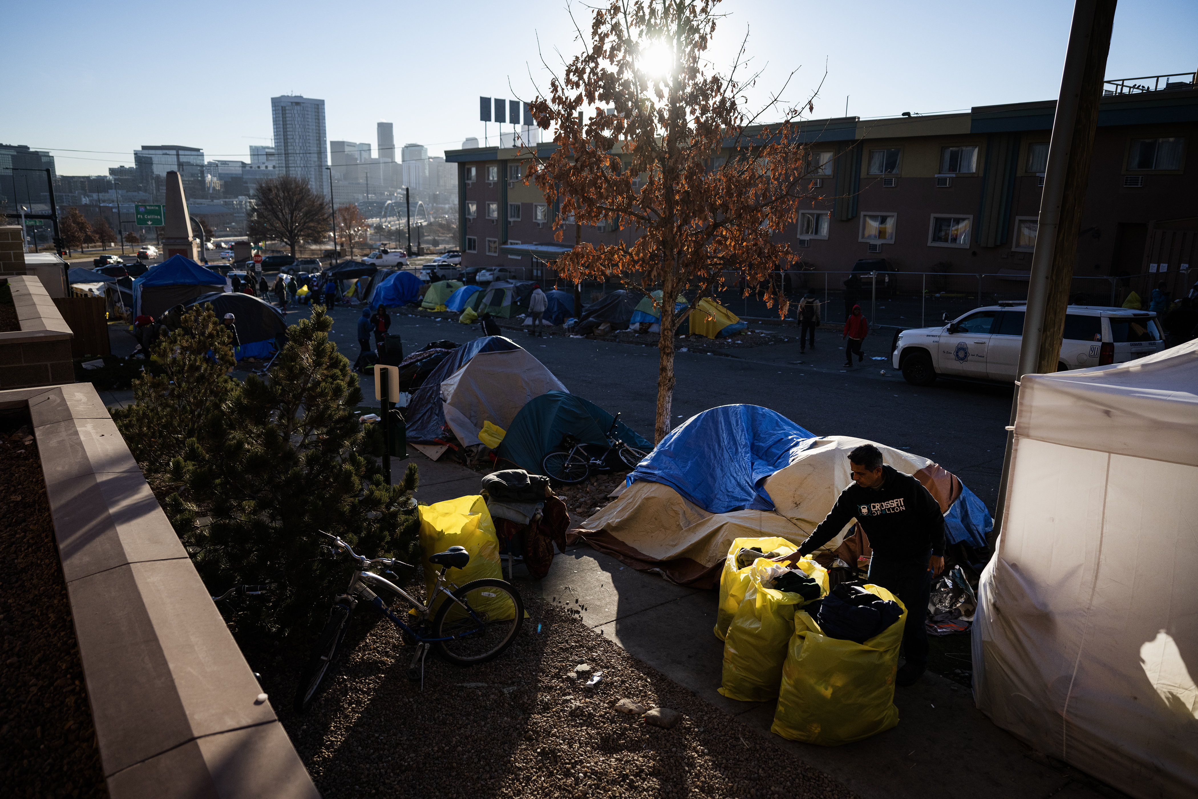 Immigrants pack up their belongings during an encampment sweep at West 27th Avenue, between Zuni and Alcott Streets on Wednesday, Jan. 3, 2024, in Denver, Colo. (Timothy Hurst/Denver Gazette) (TimHursttim.hurst@gazette.comhttps://secure.gravatar.com/avatar/aca82bd62b4ee425c598527cd6faa1b1?d=mm&r=g)