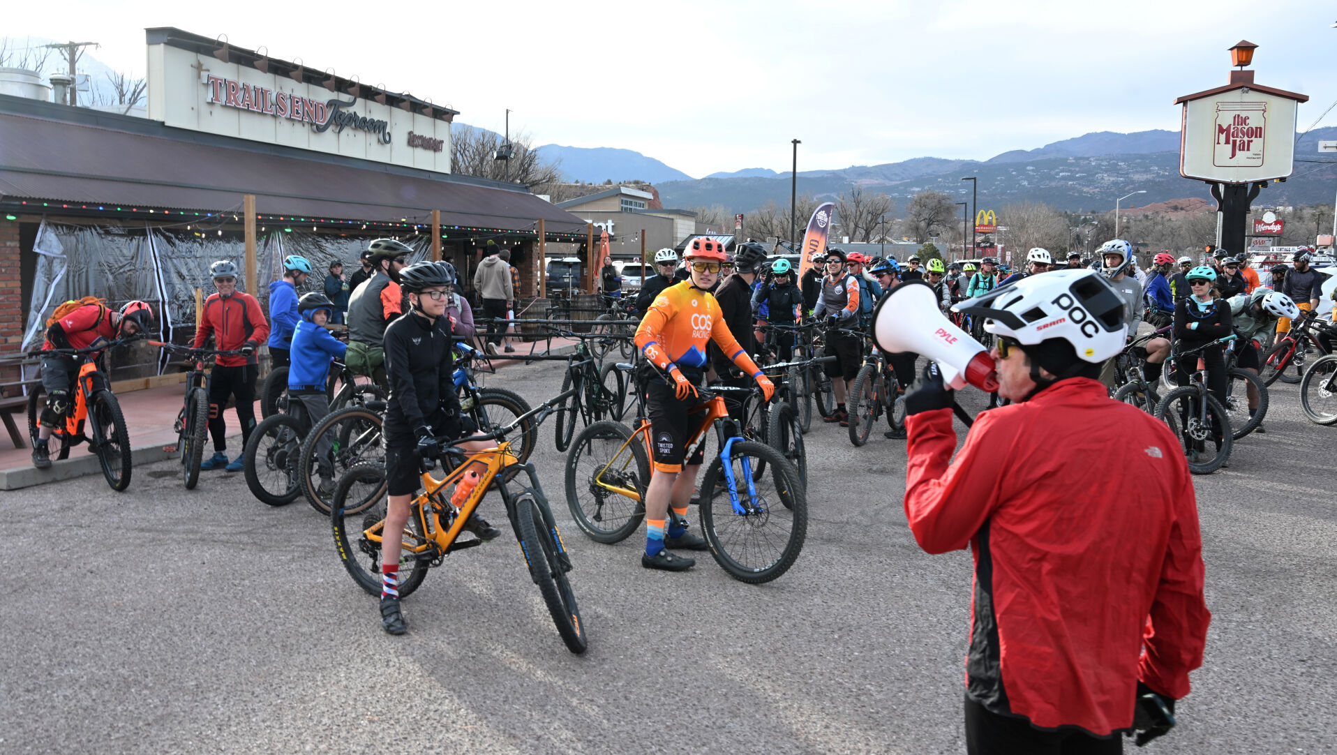 Cyclists get ready to head out from the parking lot of Trails End Taproom for an evening ride in March. Trails End at The Mason Jar is closed for the winter season. The building recently was listed for sale, and owner Kevin Weese said the future of the Colorado Springs taproom is up in the air. (Jerilee Bennett, the Gazette)